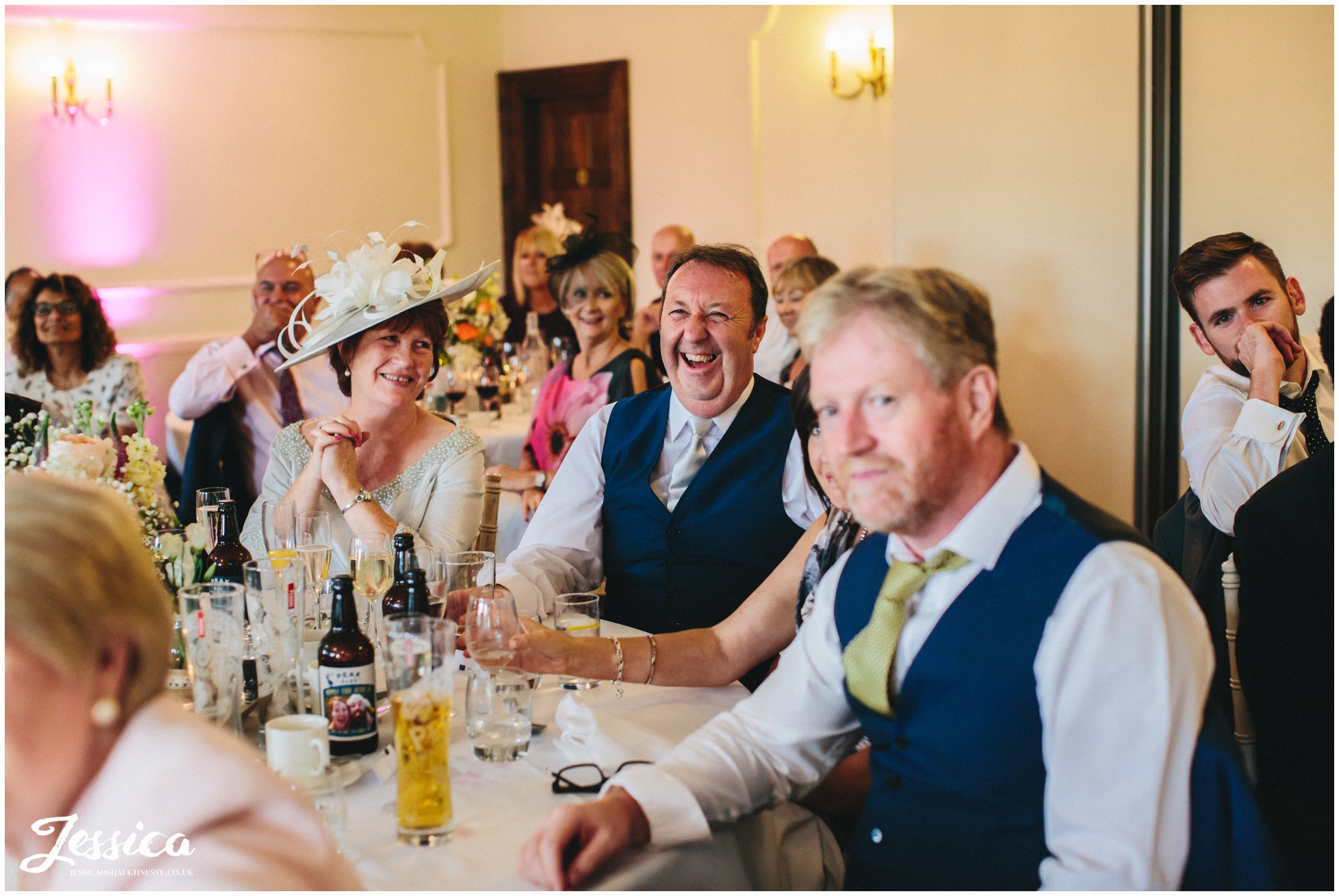 family enjoy the grooms speech at cheshire wedding