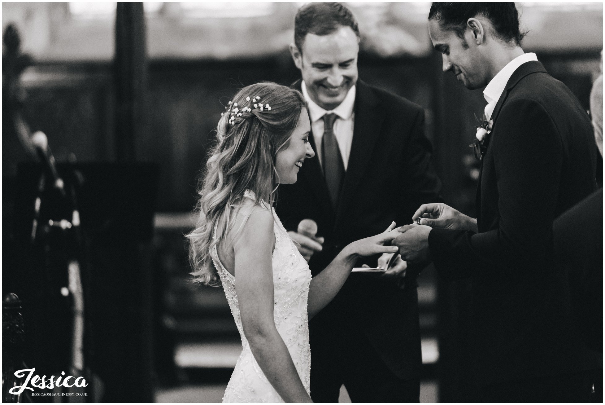 cheadle wedding photography - the couple exchange rings