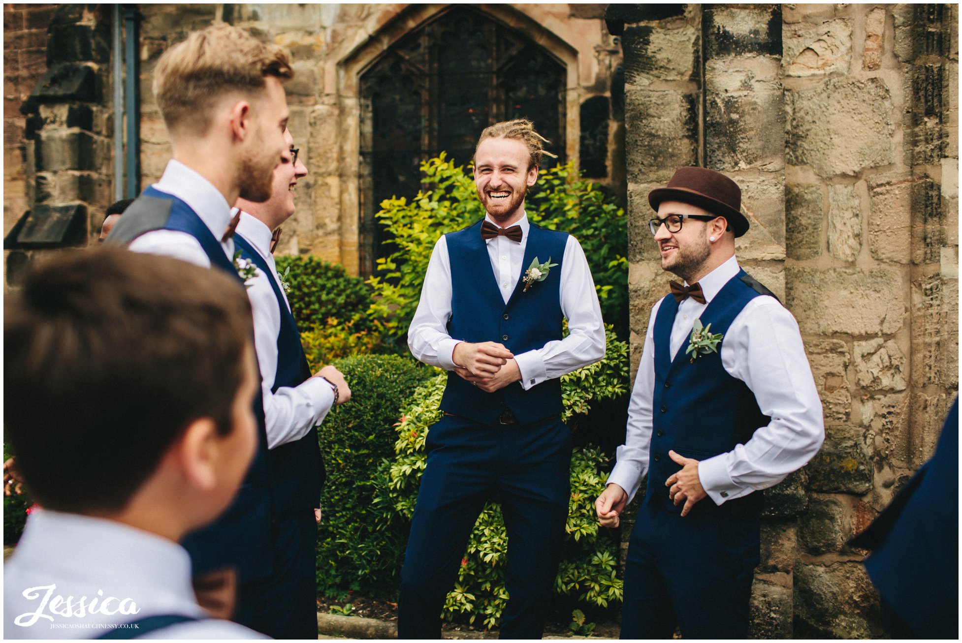 groomsmen celebrate the marriage after the service