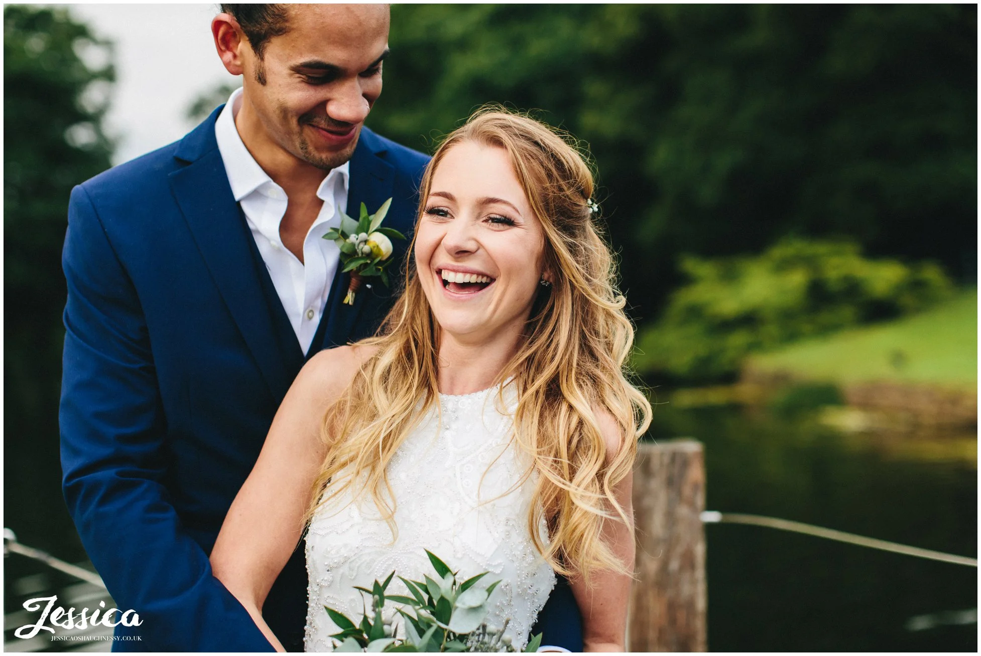 wife laughs with her husband on their wedding day