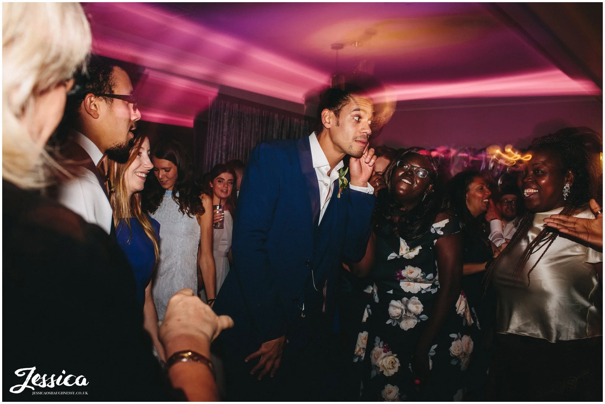 groom dancing with his friends on his cheshire wedding day