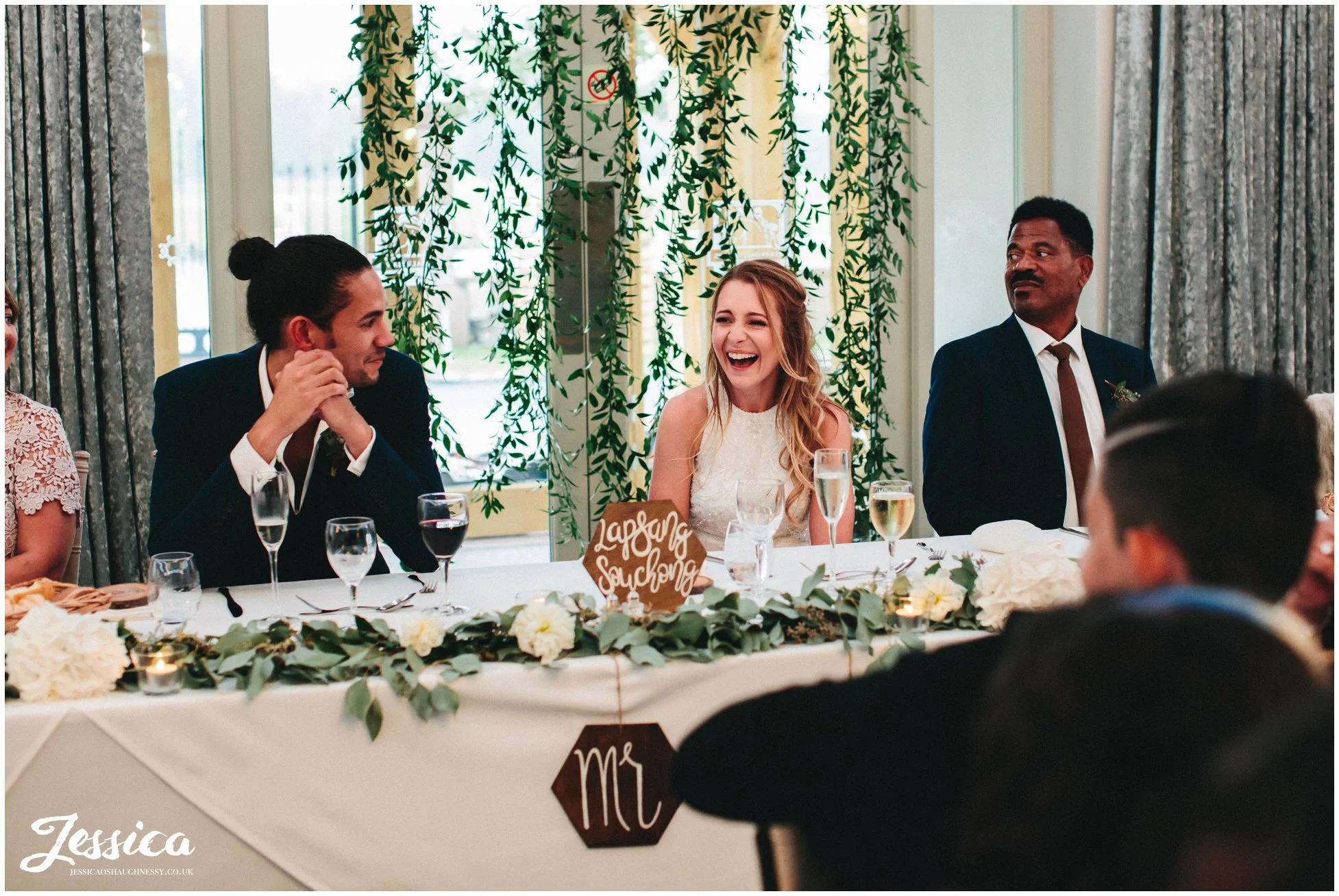 husband and wife enjoying the best mans speech