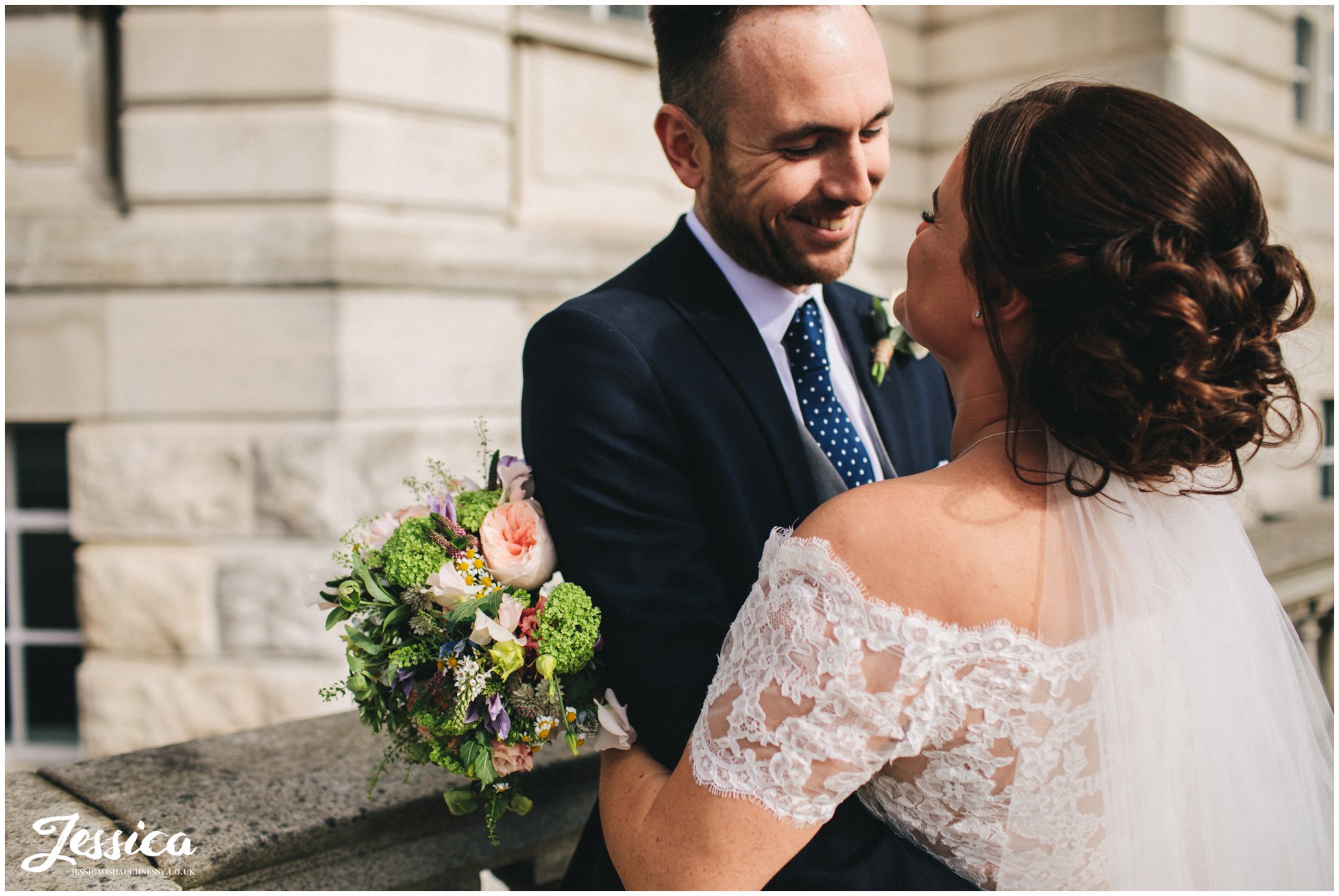 husband smiles at his new wife in liverpool