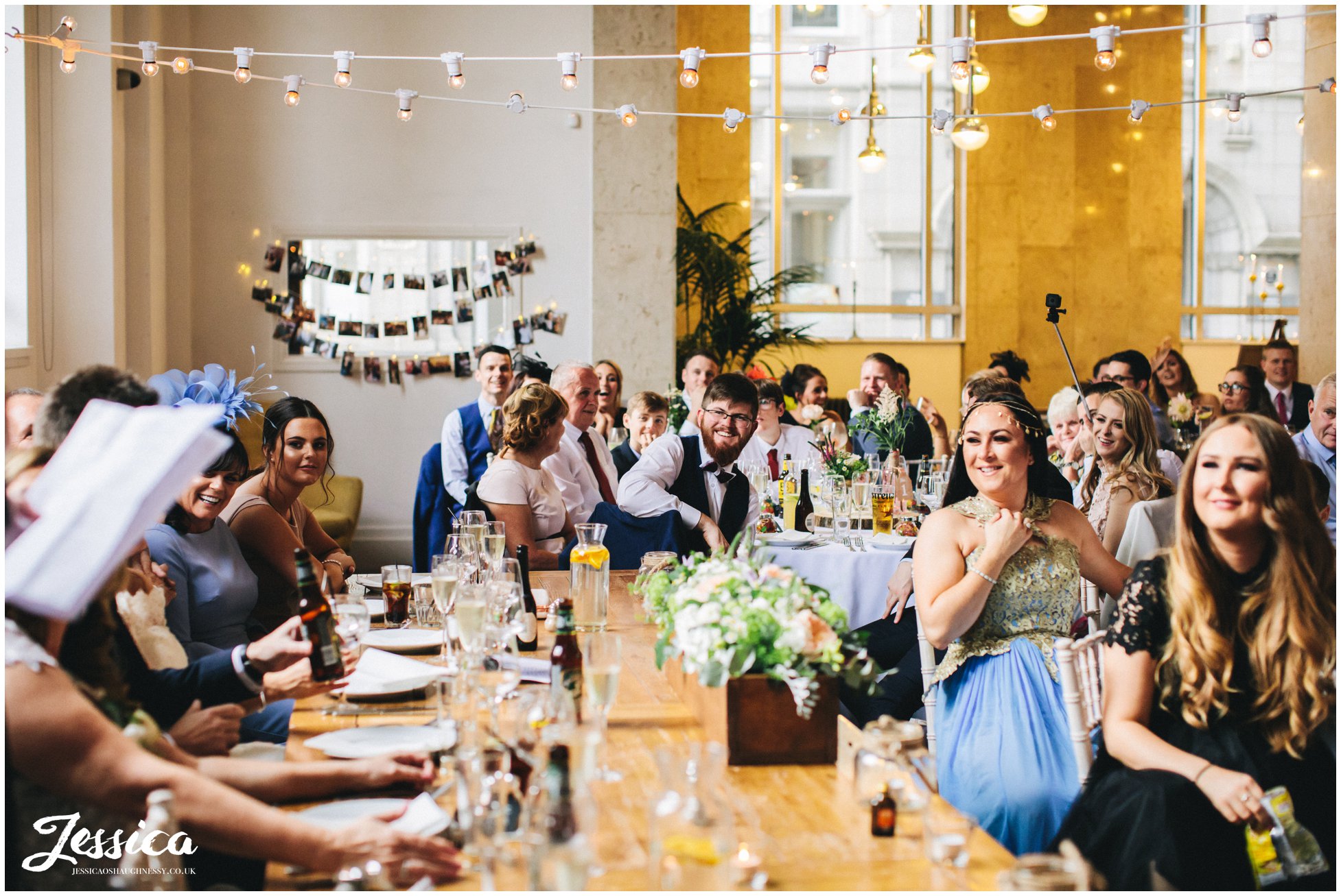 wedding guests laughing during the speeches at oh me oh my