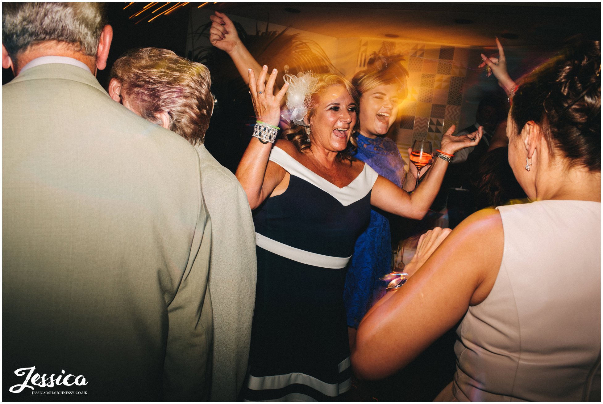 brides aunty celebrates on the dancefloor - liverpool wedding photographer
