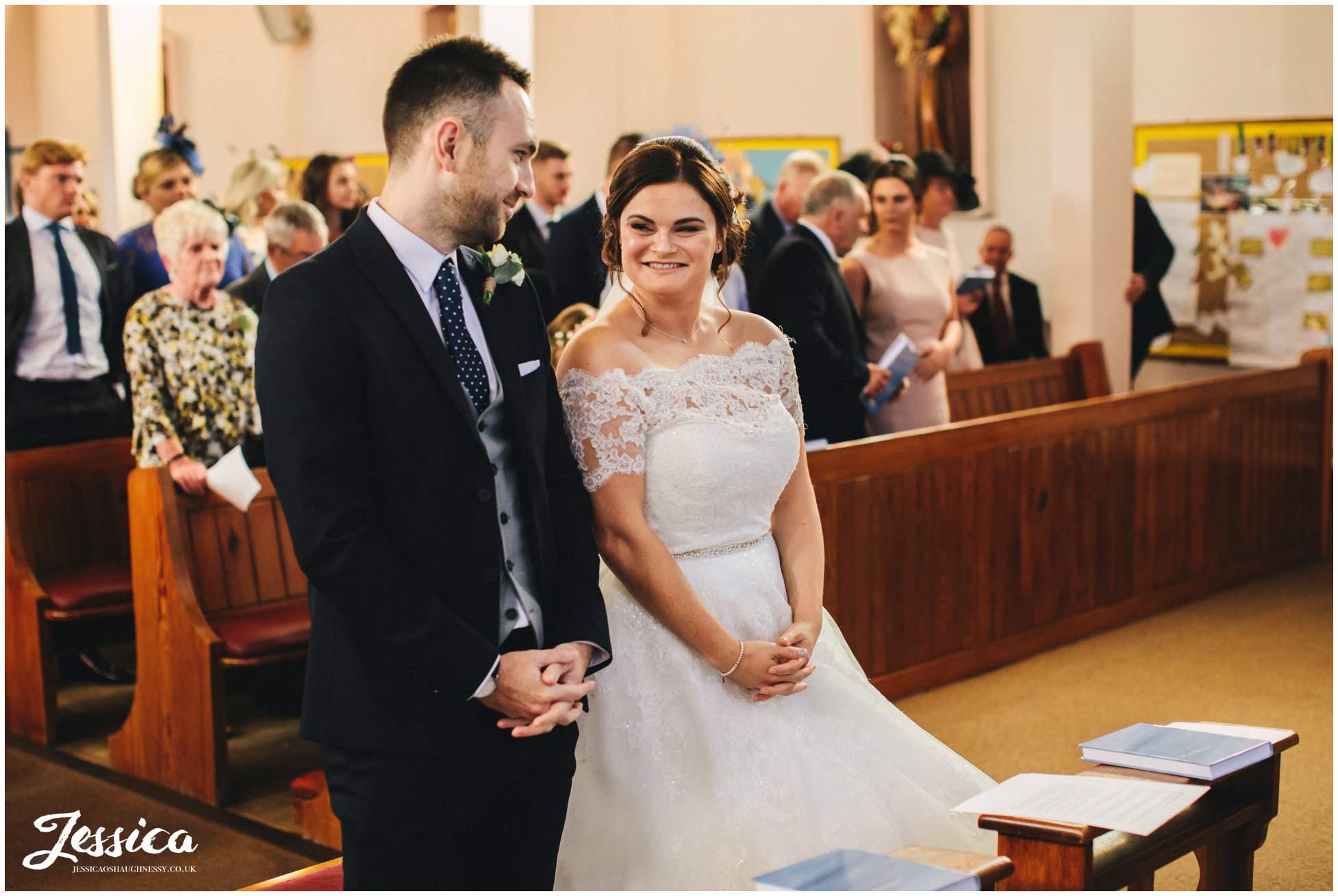 bride looks at groom during their liverpool wedding ceremony