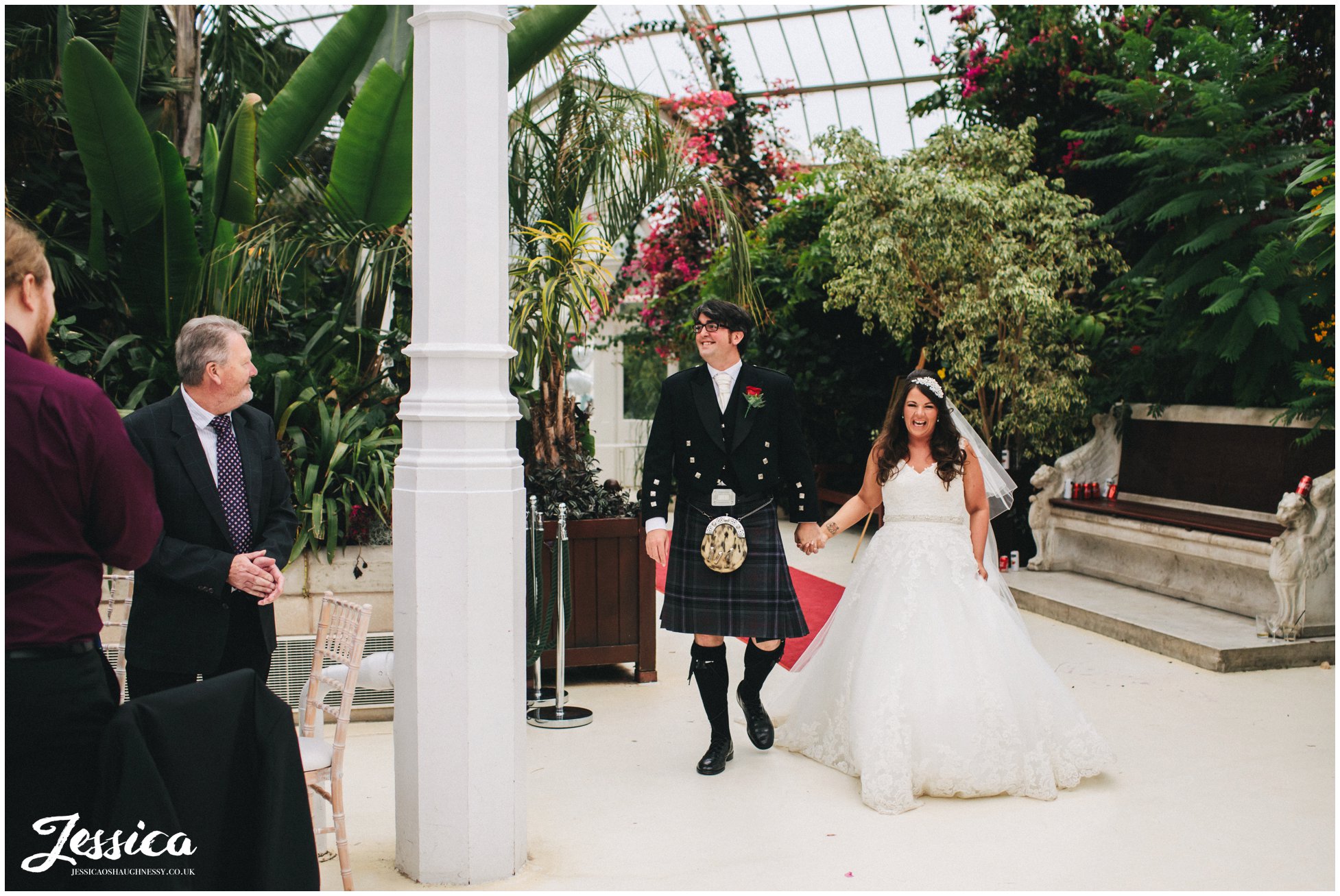 newly weds make entrance at sefton palm house in liverpool