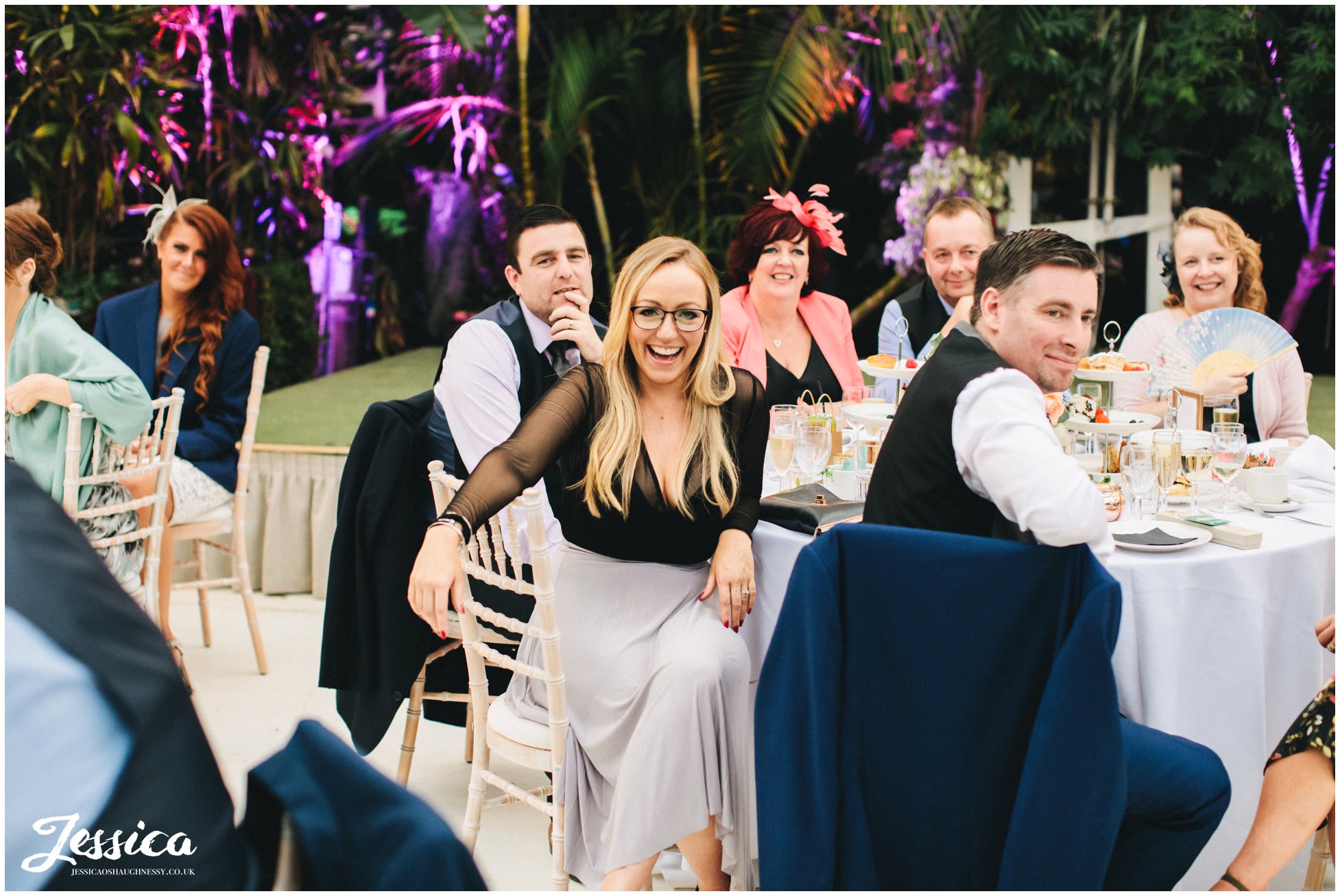 guests laughing at the best mans speech