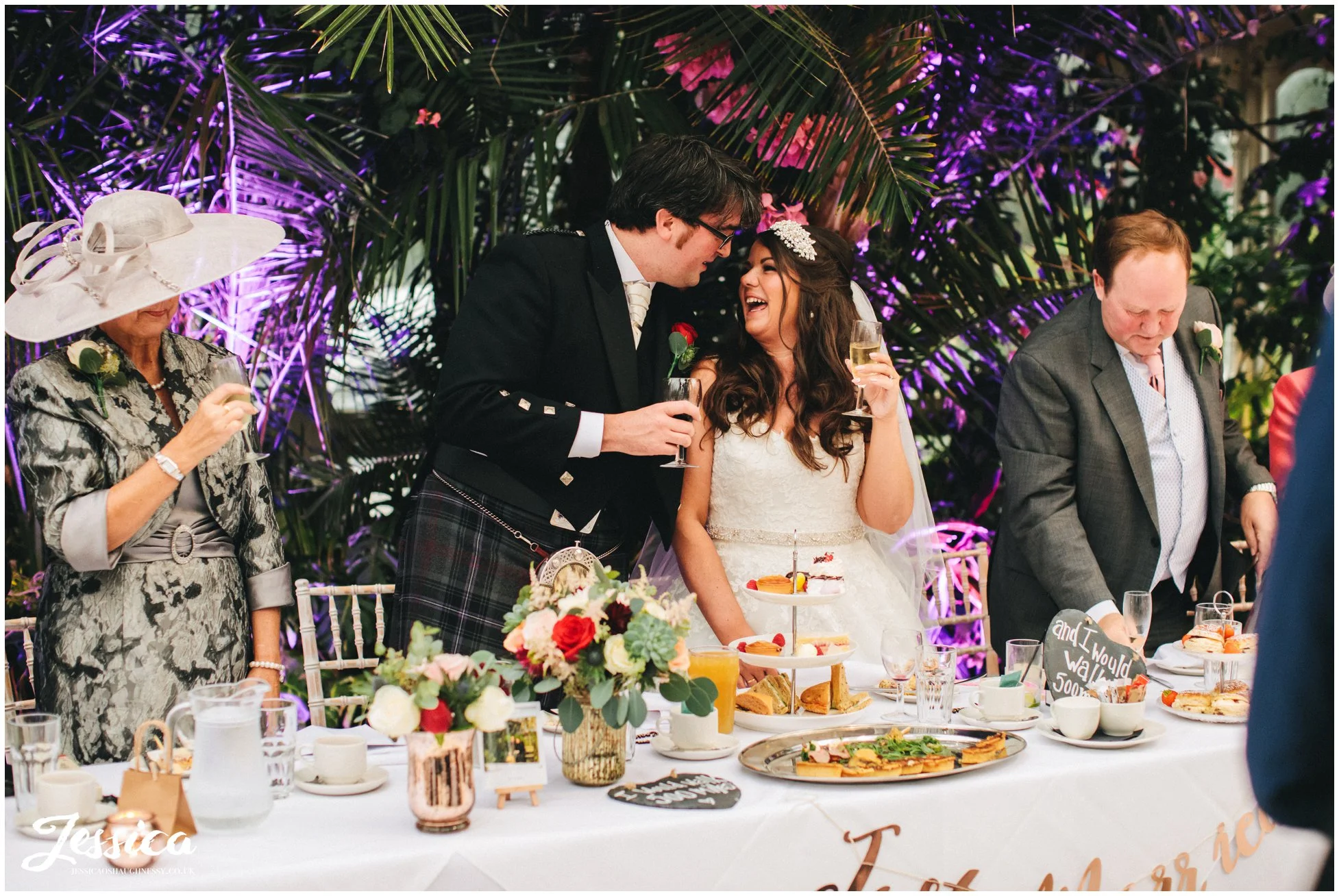 groom leans in to kiss bride