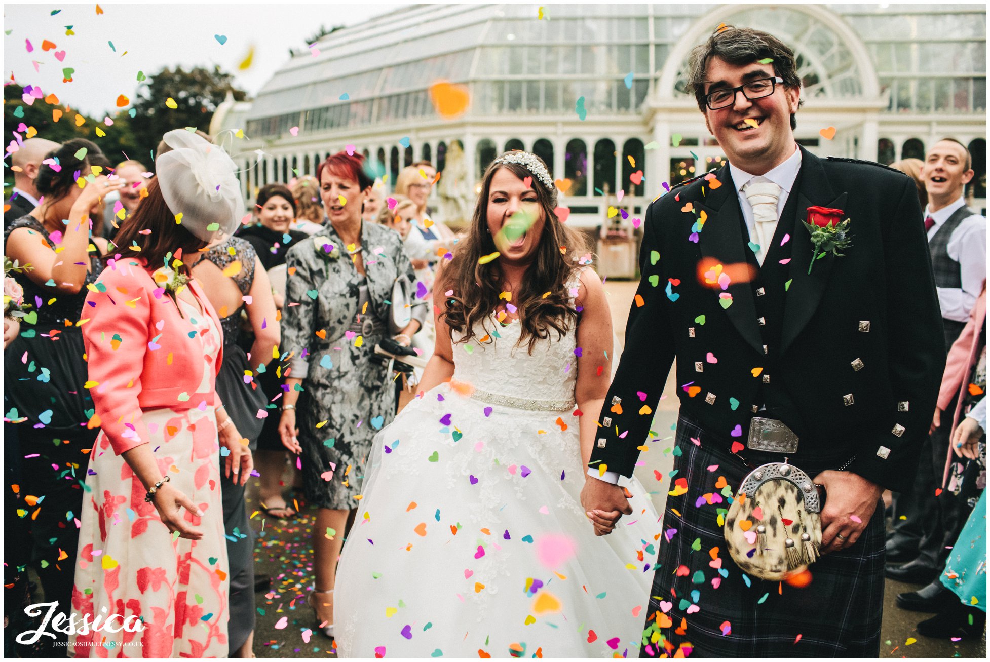 colourful confetti thrown over couple