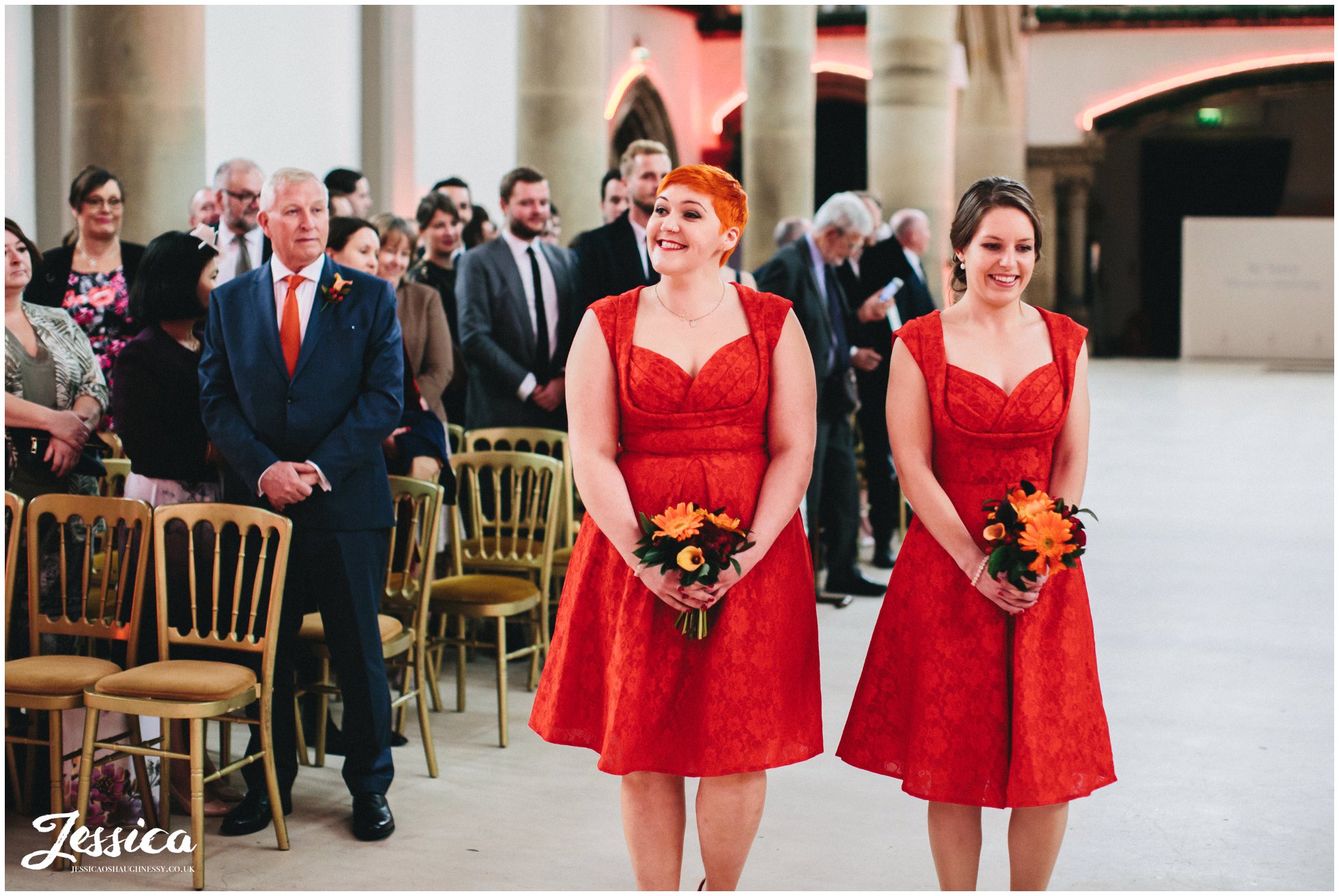 bridesmaids walk down the aisle at gorton monastery in manchester