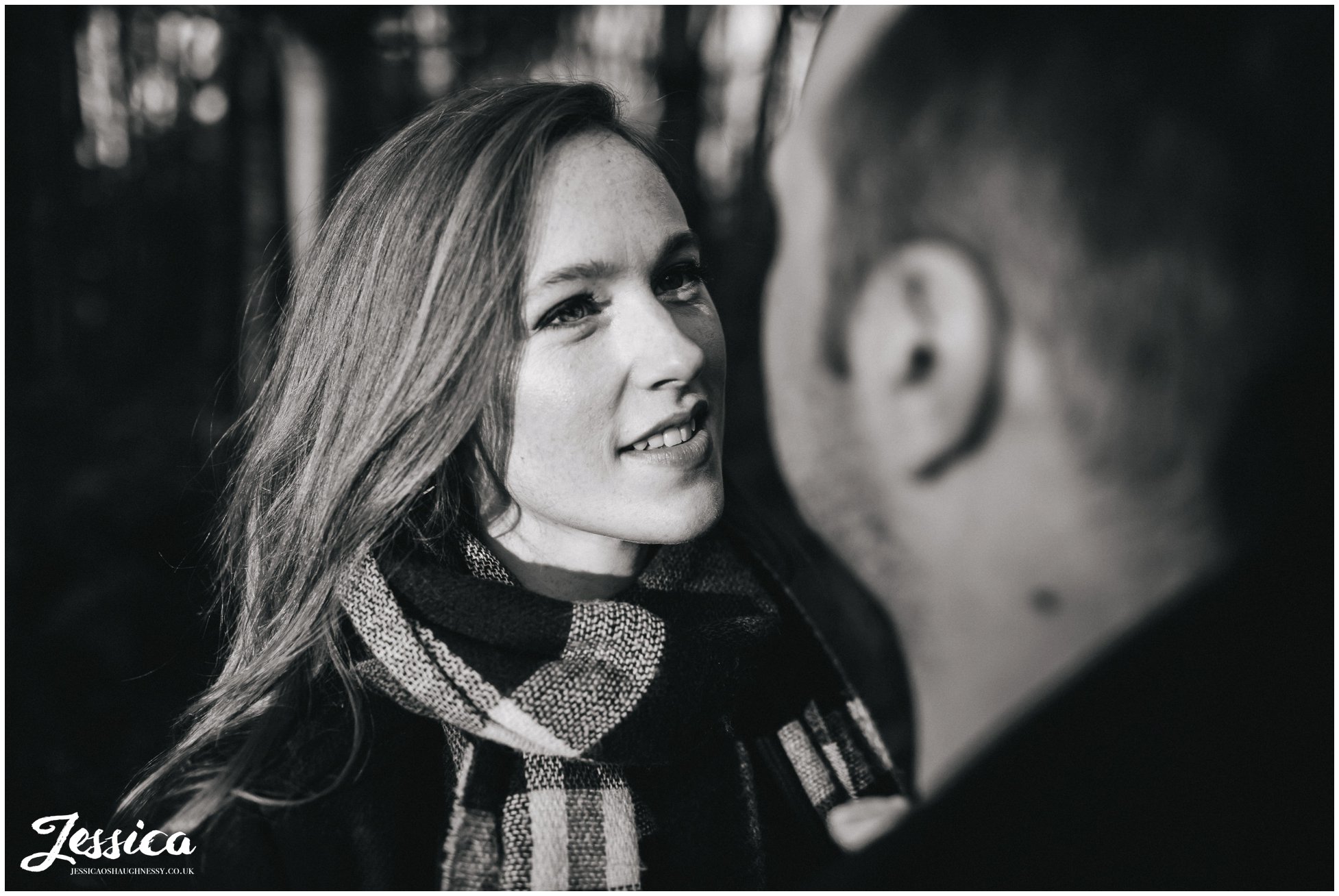 black and white photograph of girl looking at her fiance