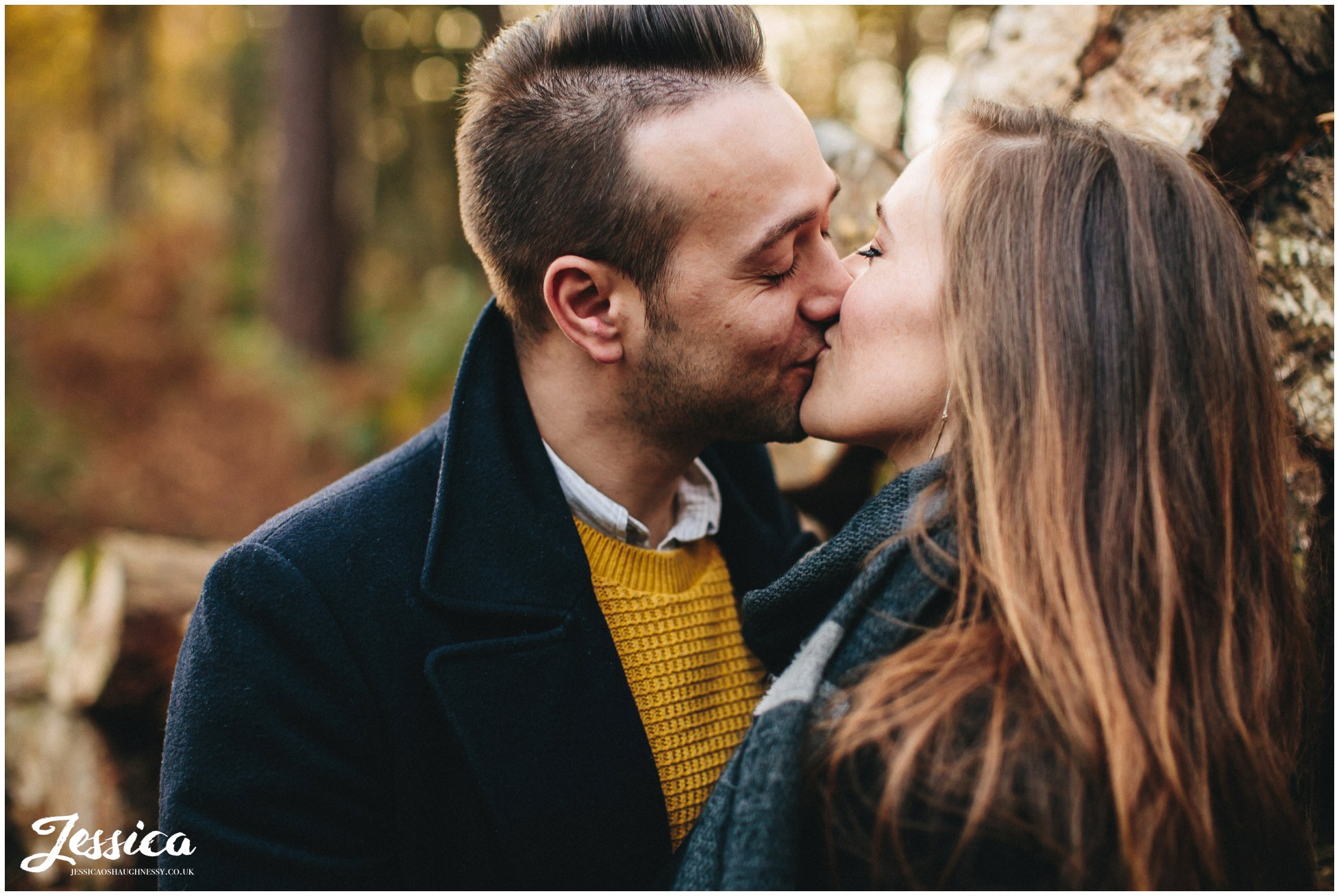 close up of engaged couple kissing