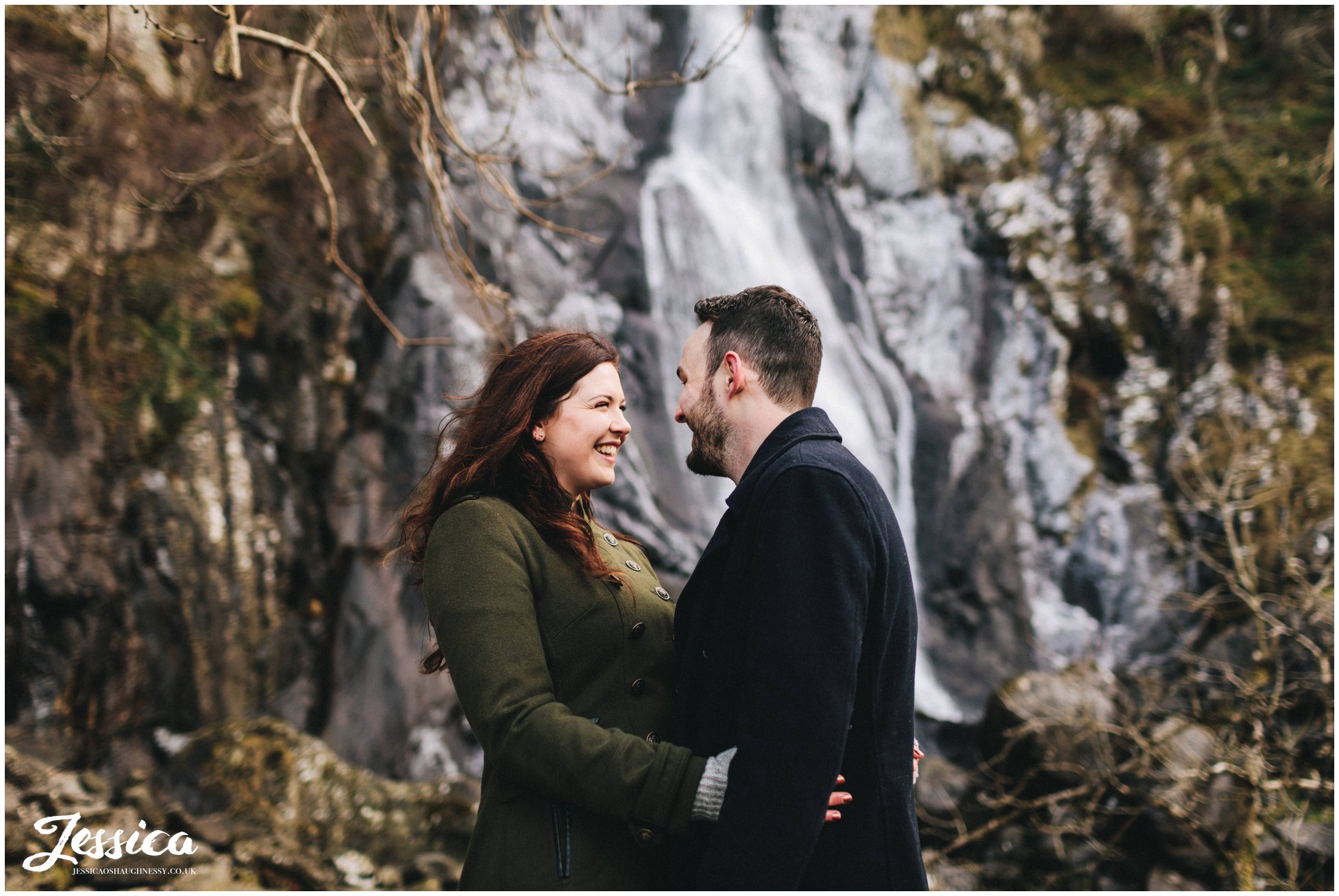 couple in front of aber waterfalls, north wales
