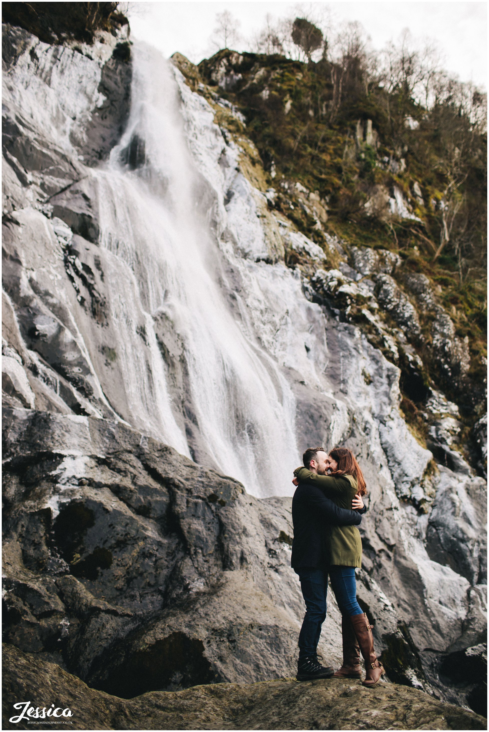 couple kissing in front of the waterfall, north wales wedding photographer