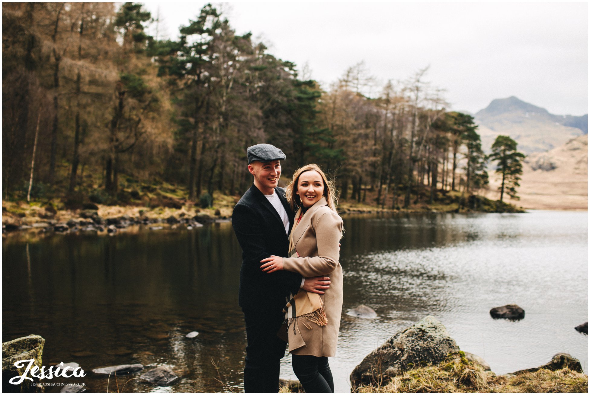 couple stand in front of blea tarn lake - lake district wedding photographer