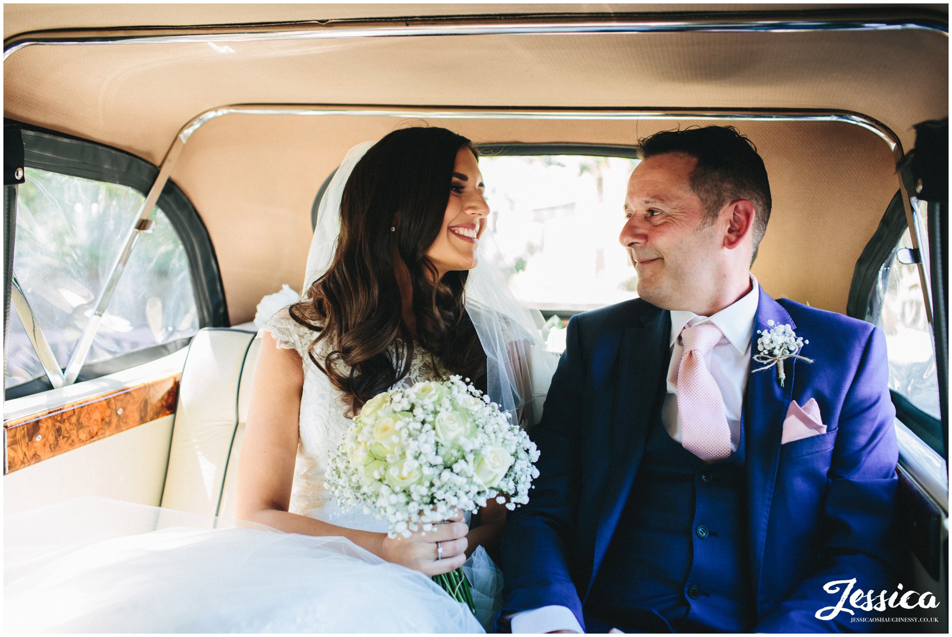 bride & her father in the wedding car