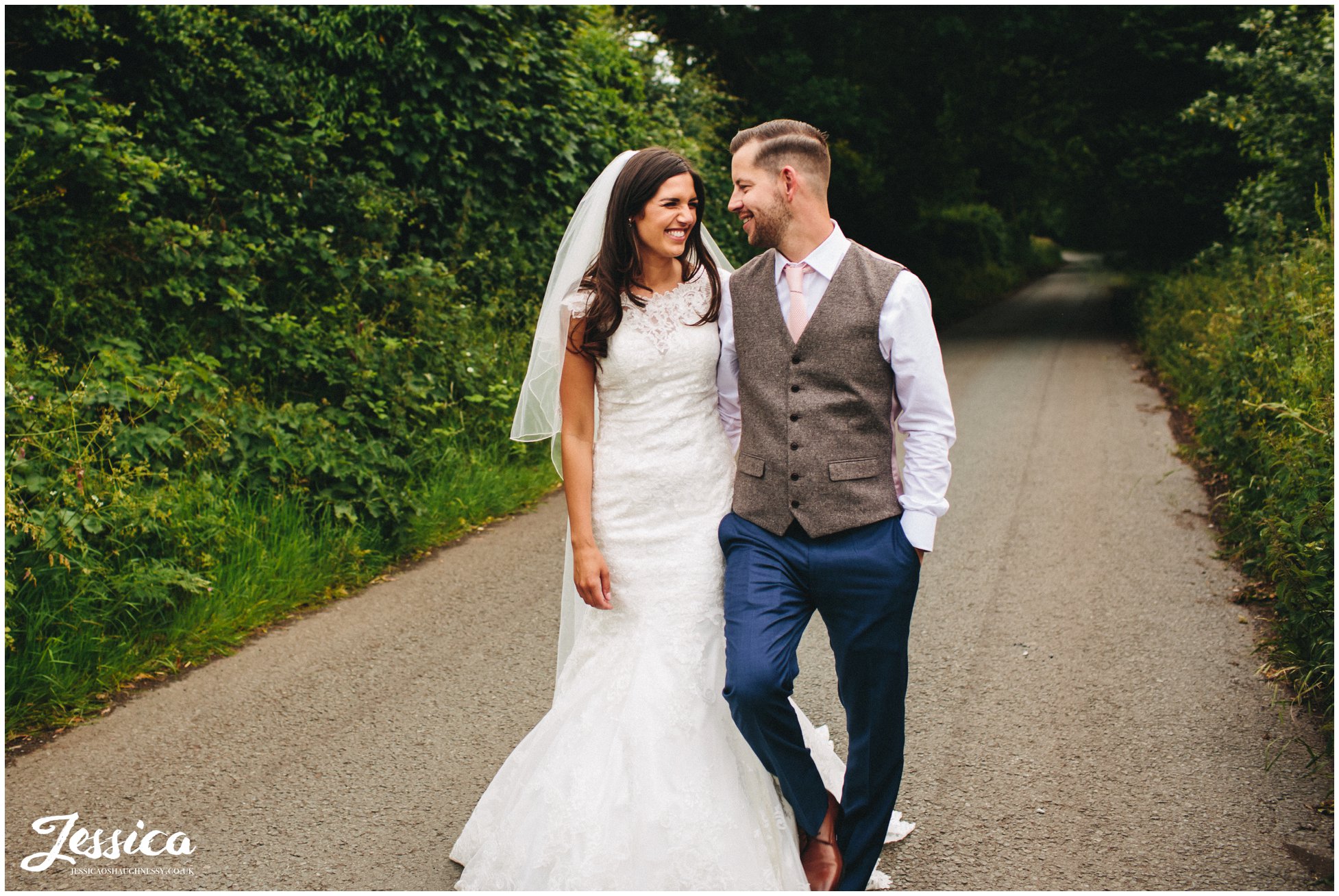 newlywed's walk down country lanes outside their wirral wedding venue