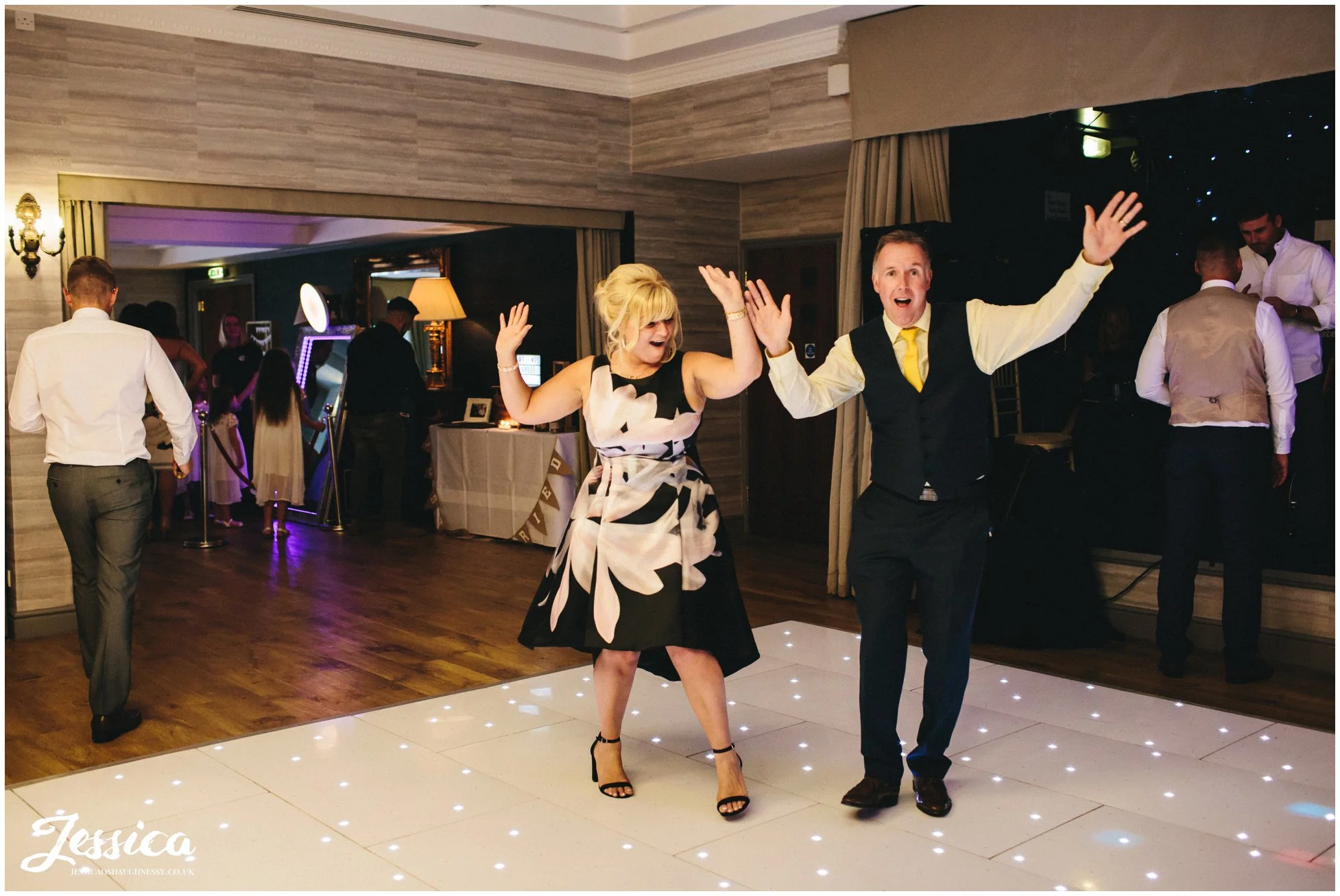 guests warming up the dancefloor at the wedding reception