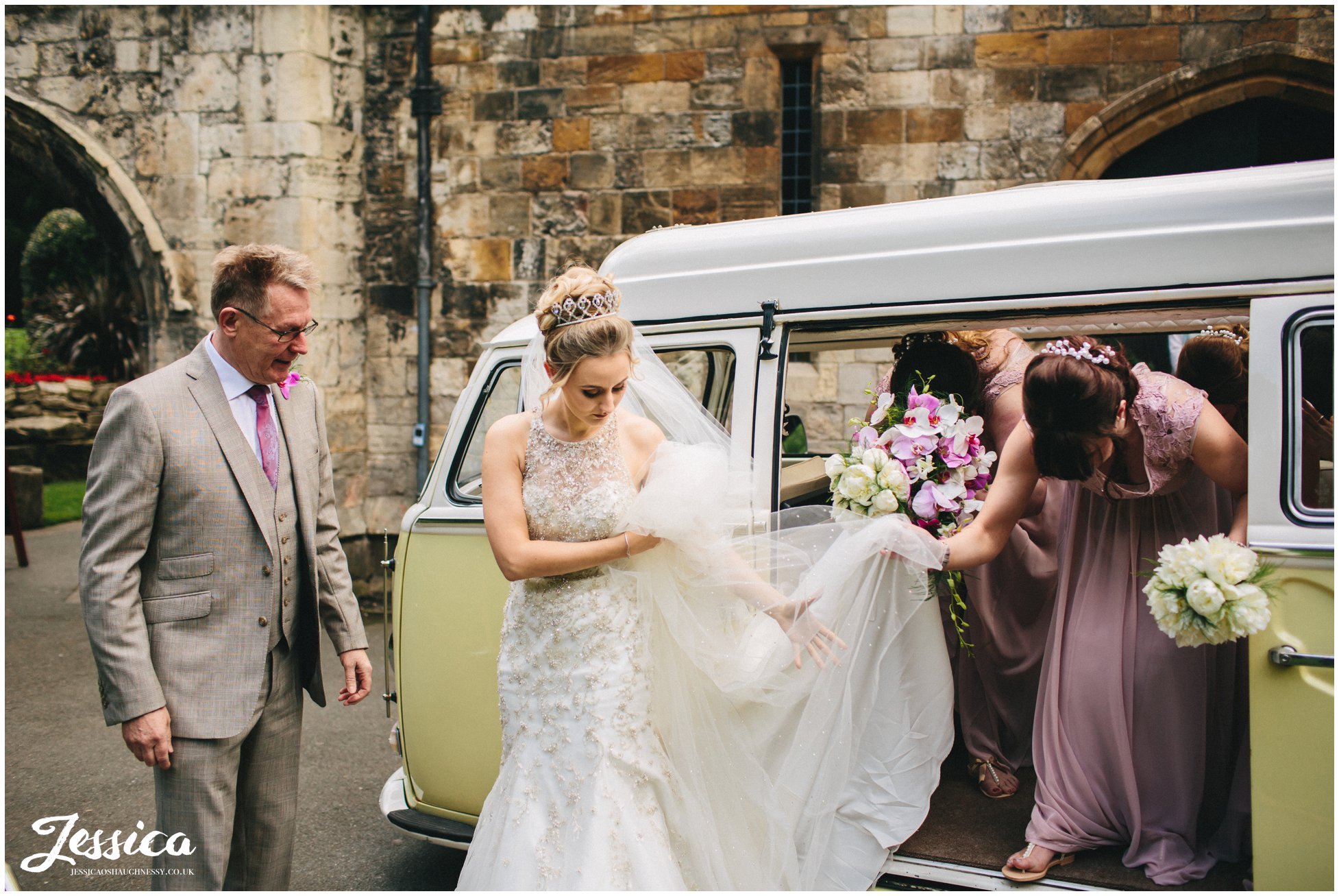 bride gets out of her wedding car for the ceremony