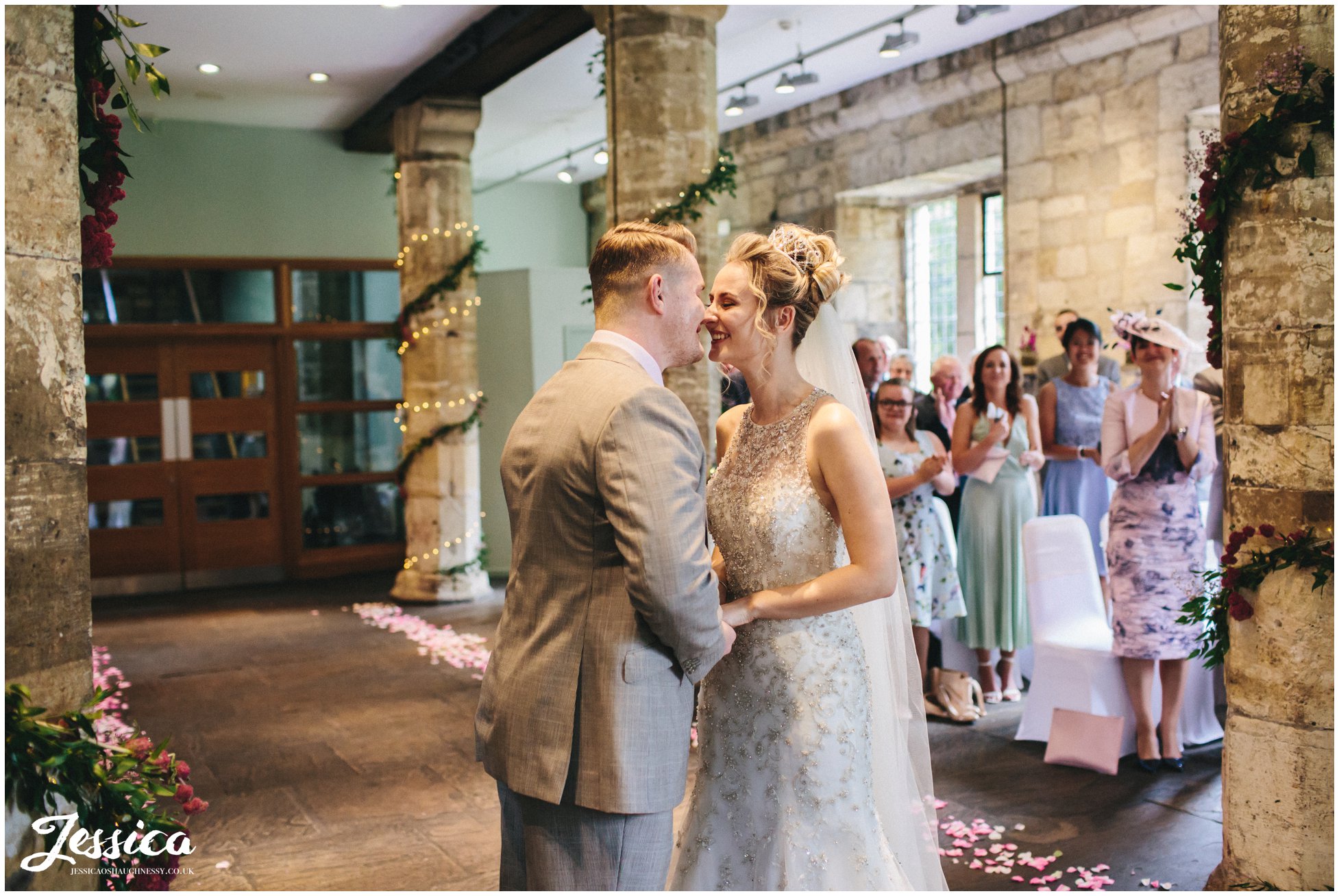 bride & groom share their first kiss together