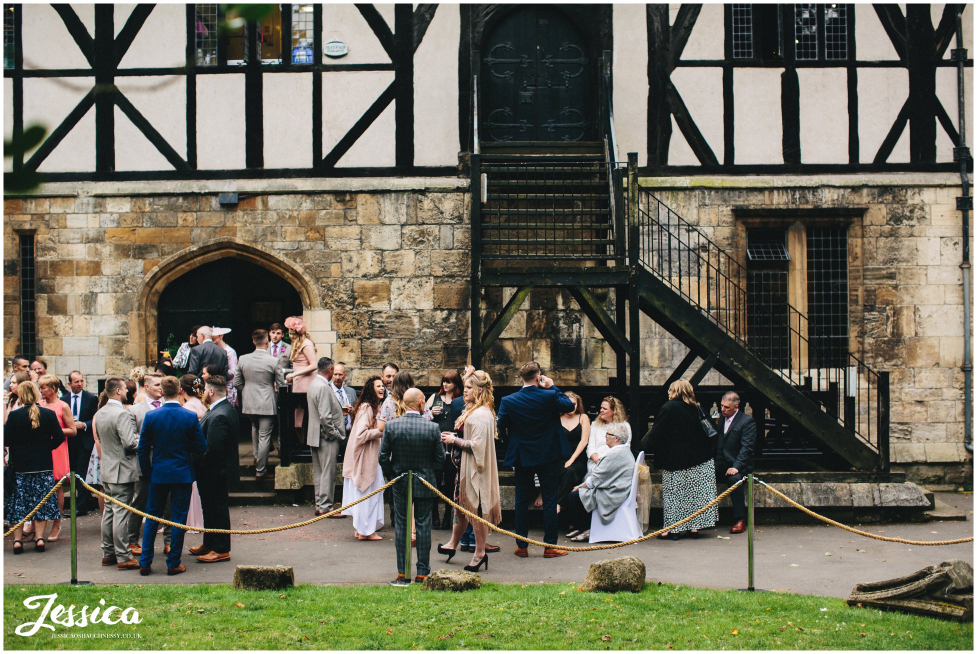 guests celebrate the marriage outside the hospitium in york