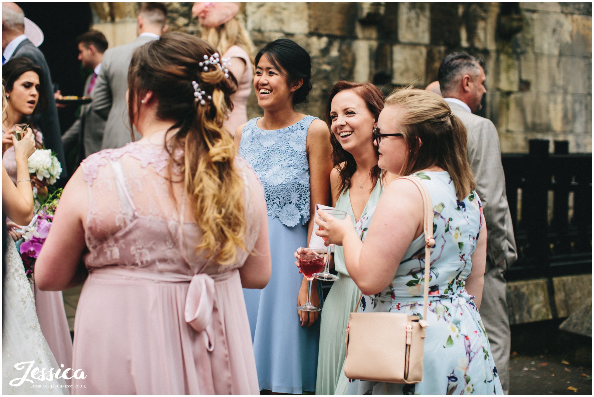 the brides friends laughing at a york wedding venue
