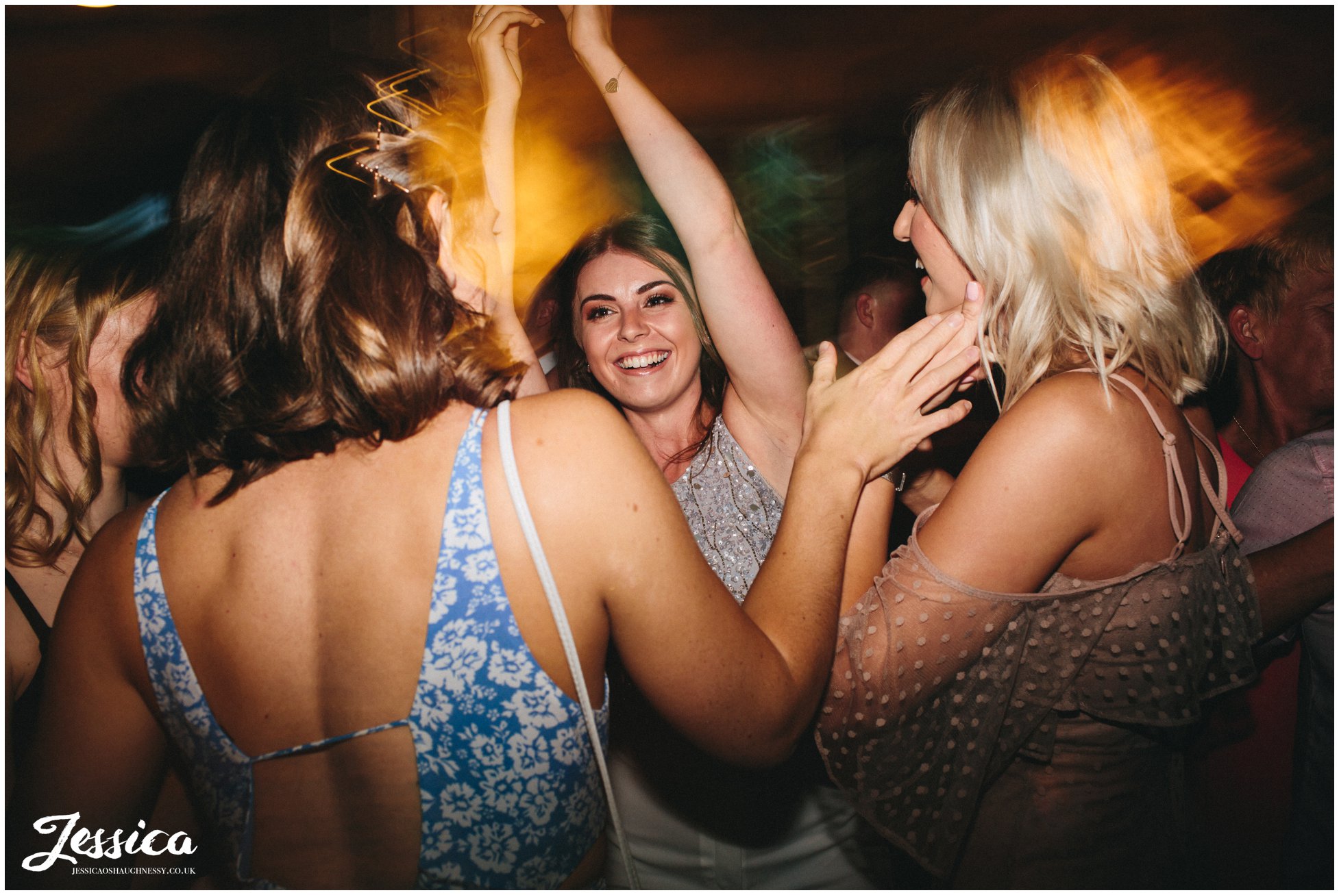 guests join the couple on the dancefloor