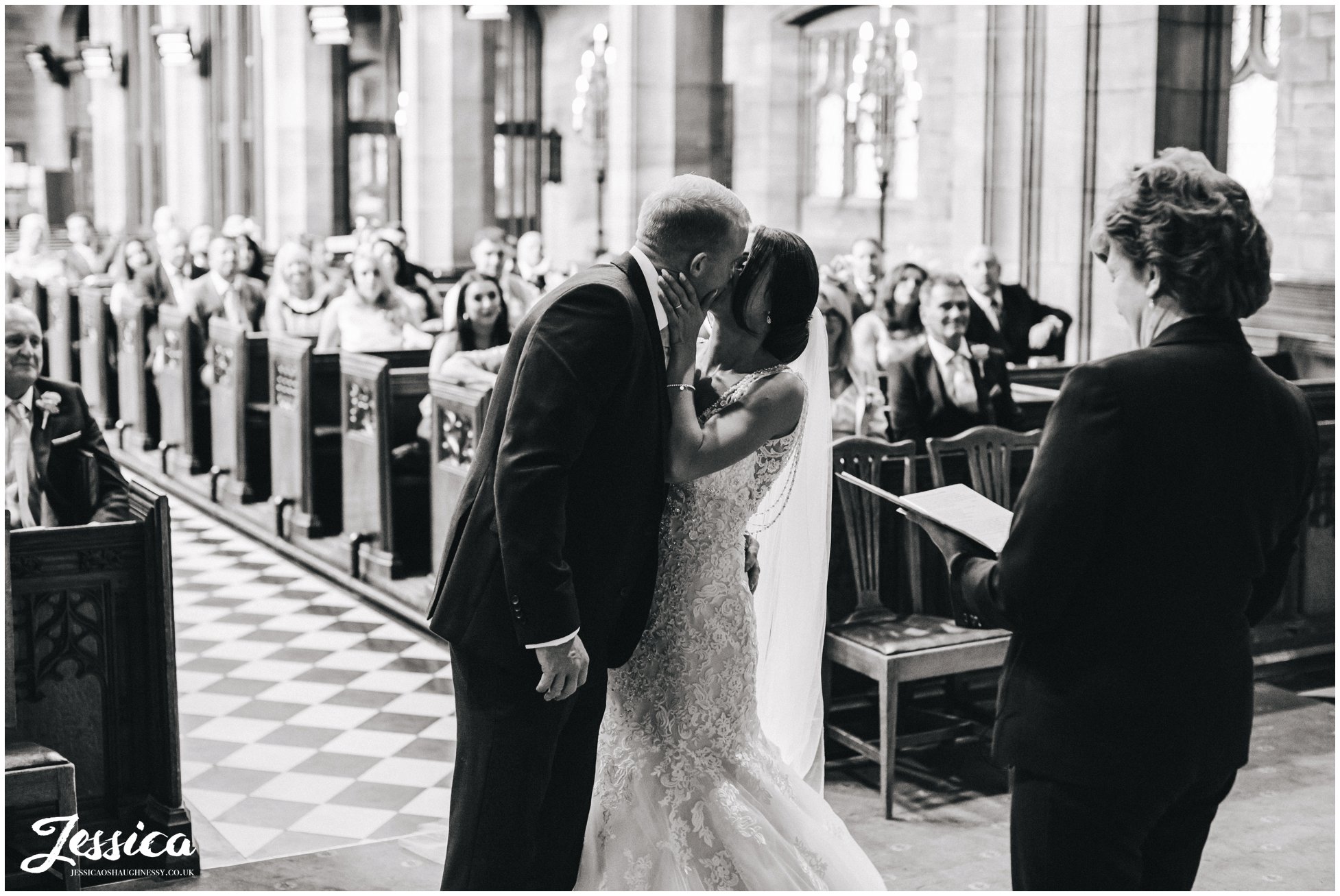 bride & groom share their first kiss