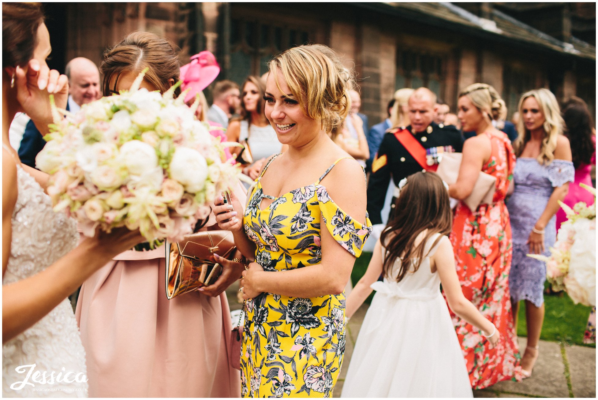 wedding guests wear bright colours for the summer wedding