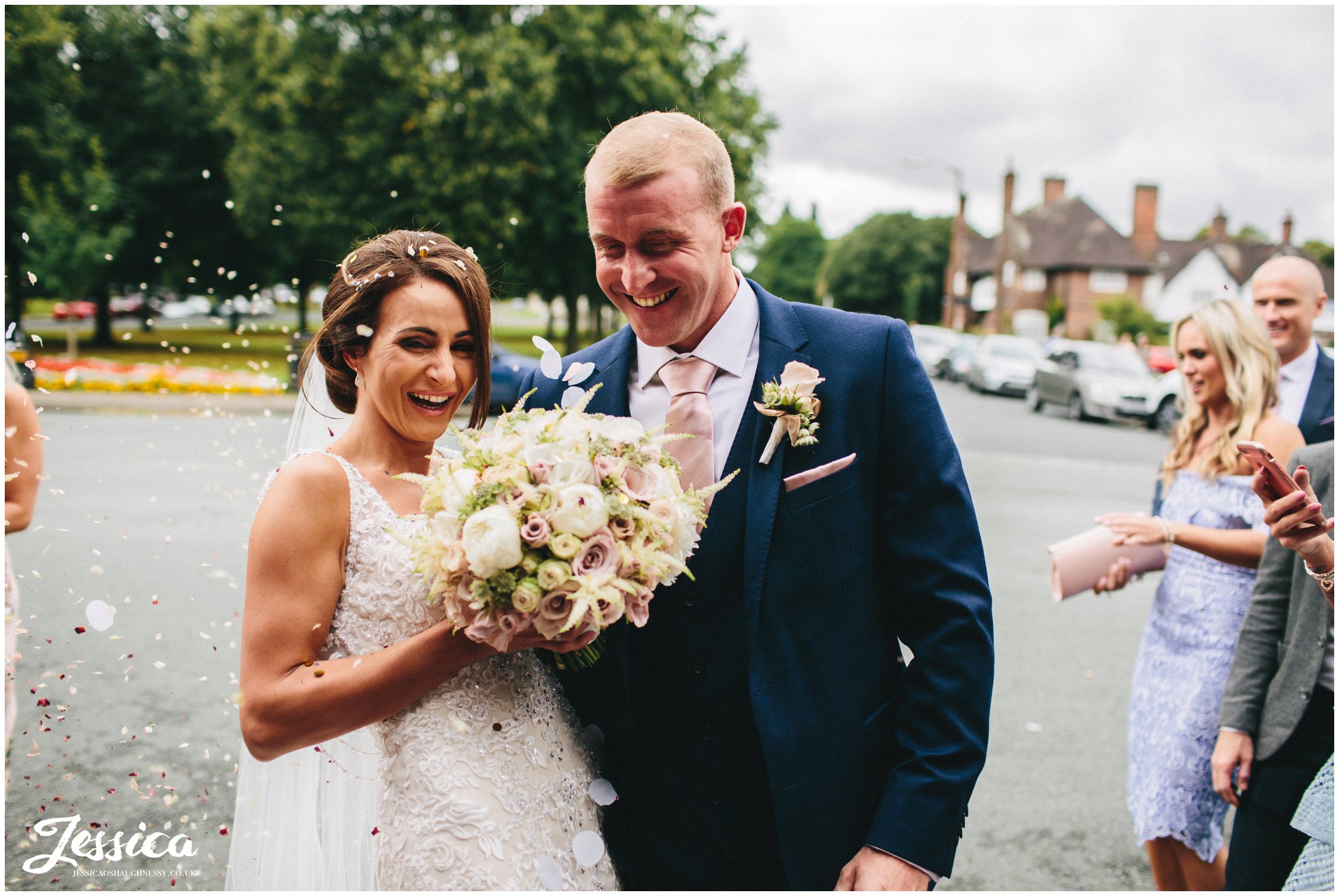 newly wed's are showered in confetti