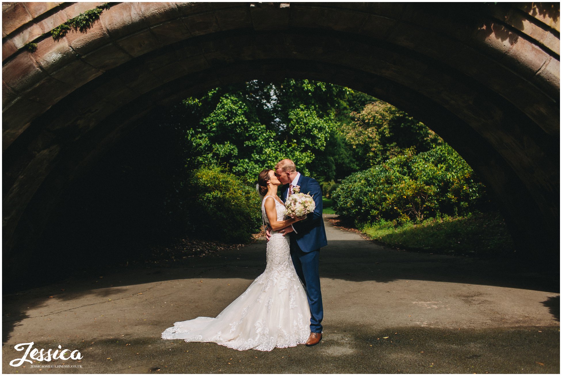 couple kissing under the bridge in port sunlight, the wirral