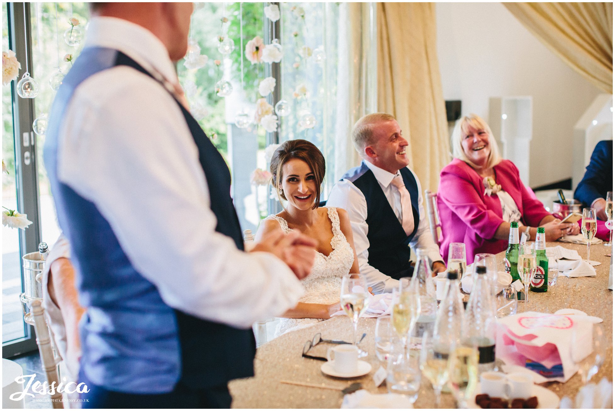 top table laughing during the father of the brides speech