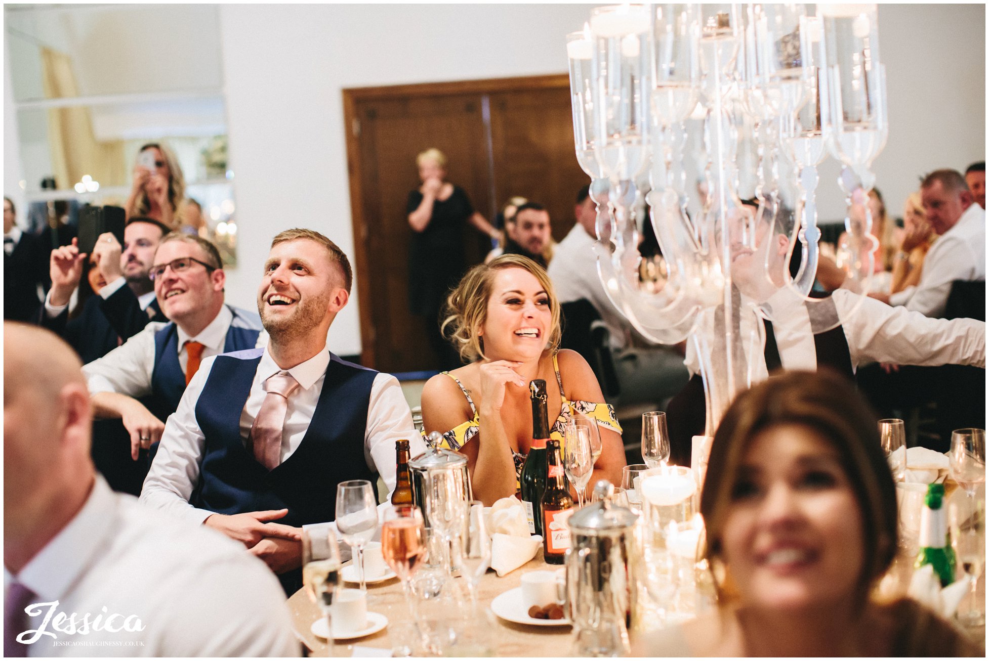 wedding guests celebrating during the wedding meal