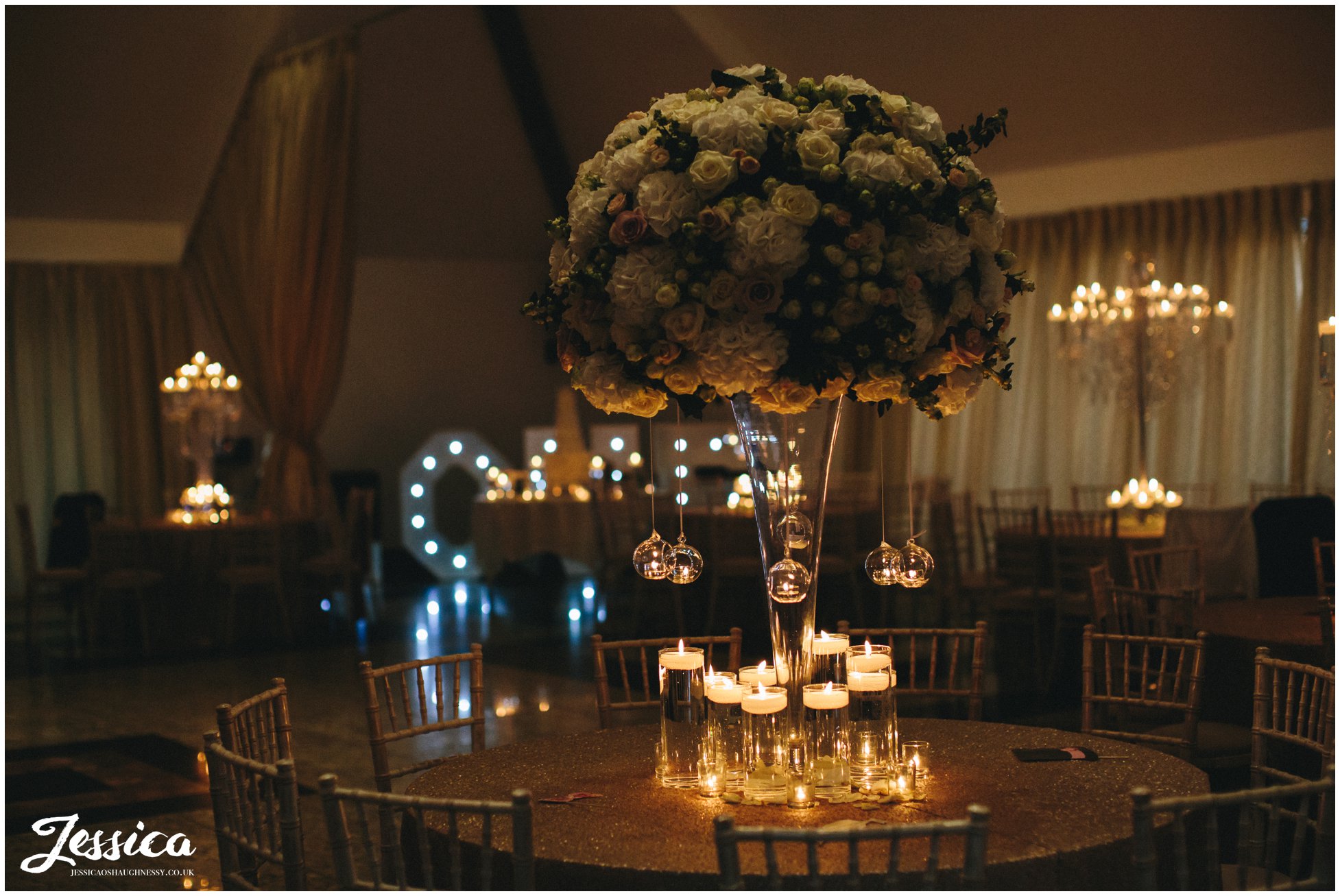 wedding room lit with candles ready for the reception