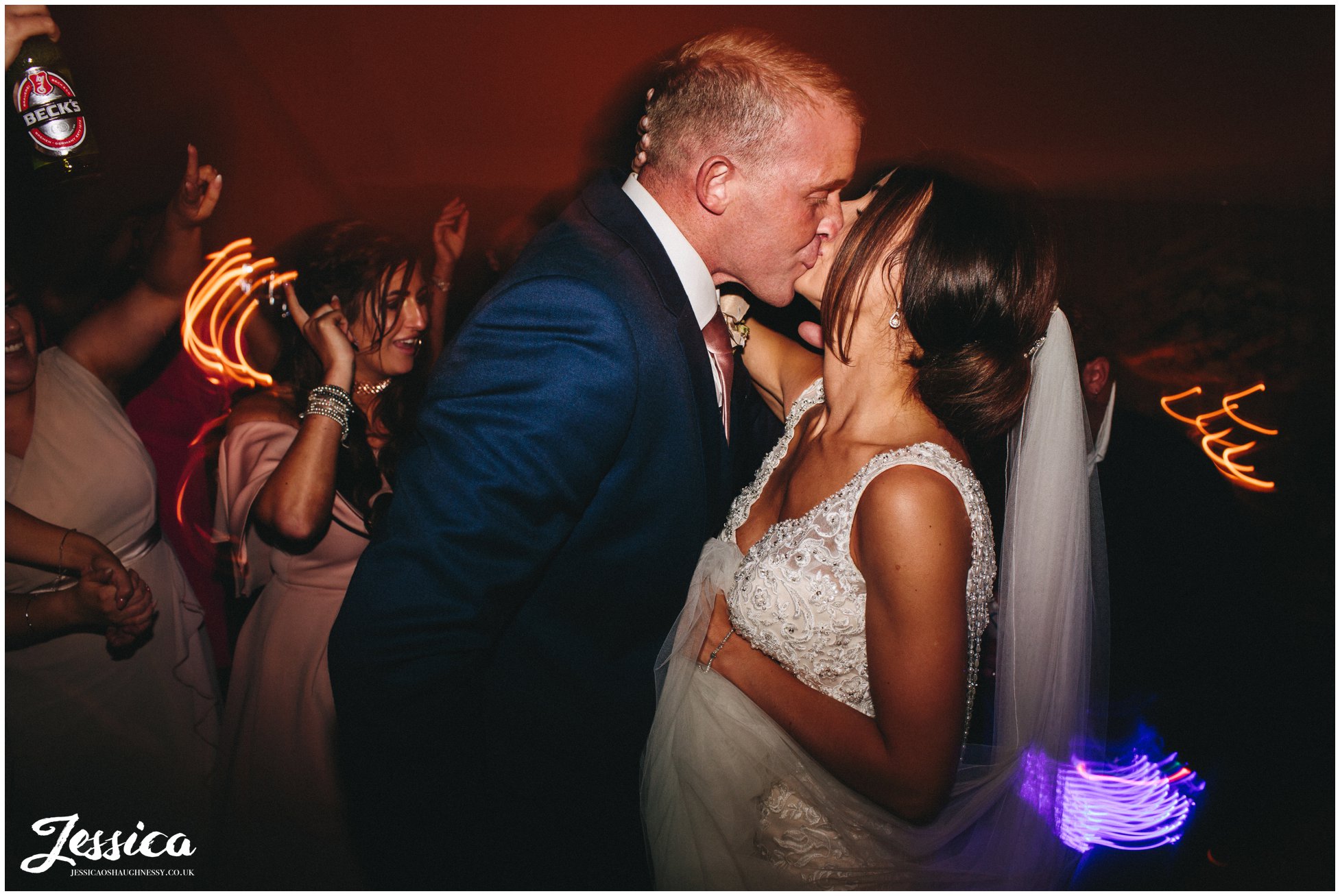 newly wed's share a kiss during their first dance