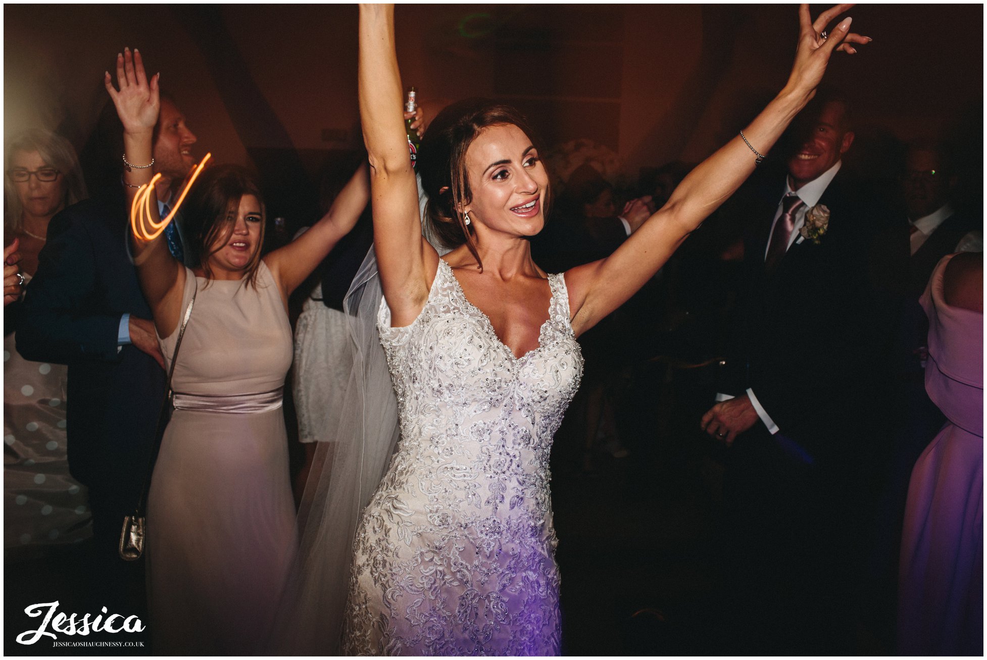 bride dances on her wedding day at the leverhulme hotel