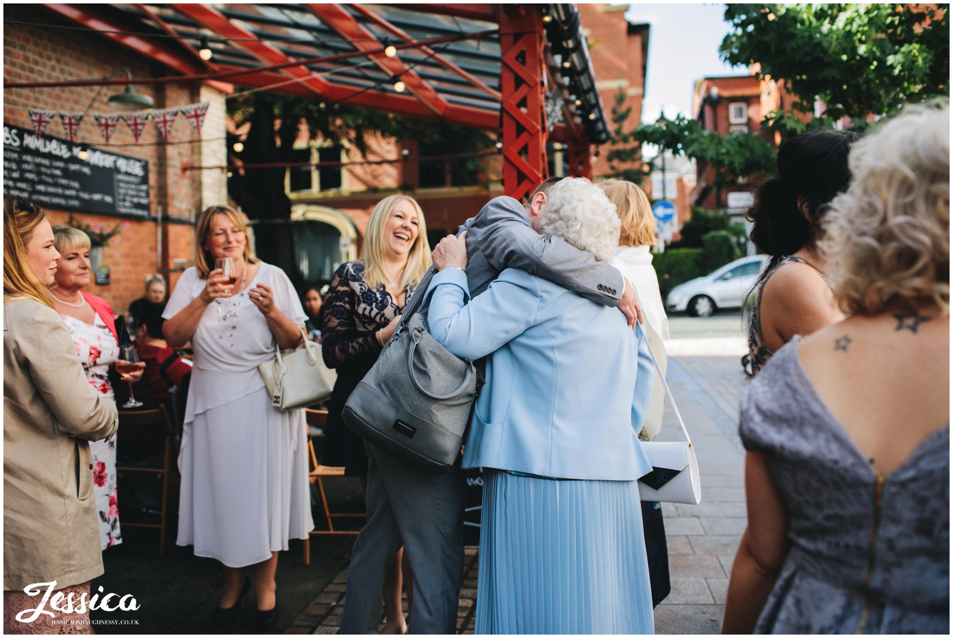 guests greet each other at altrincham town hall before the ceremony