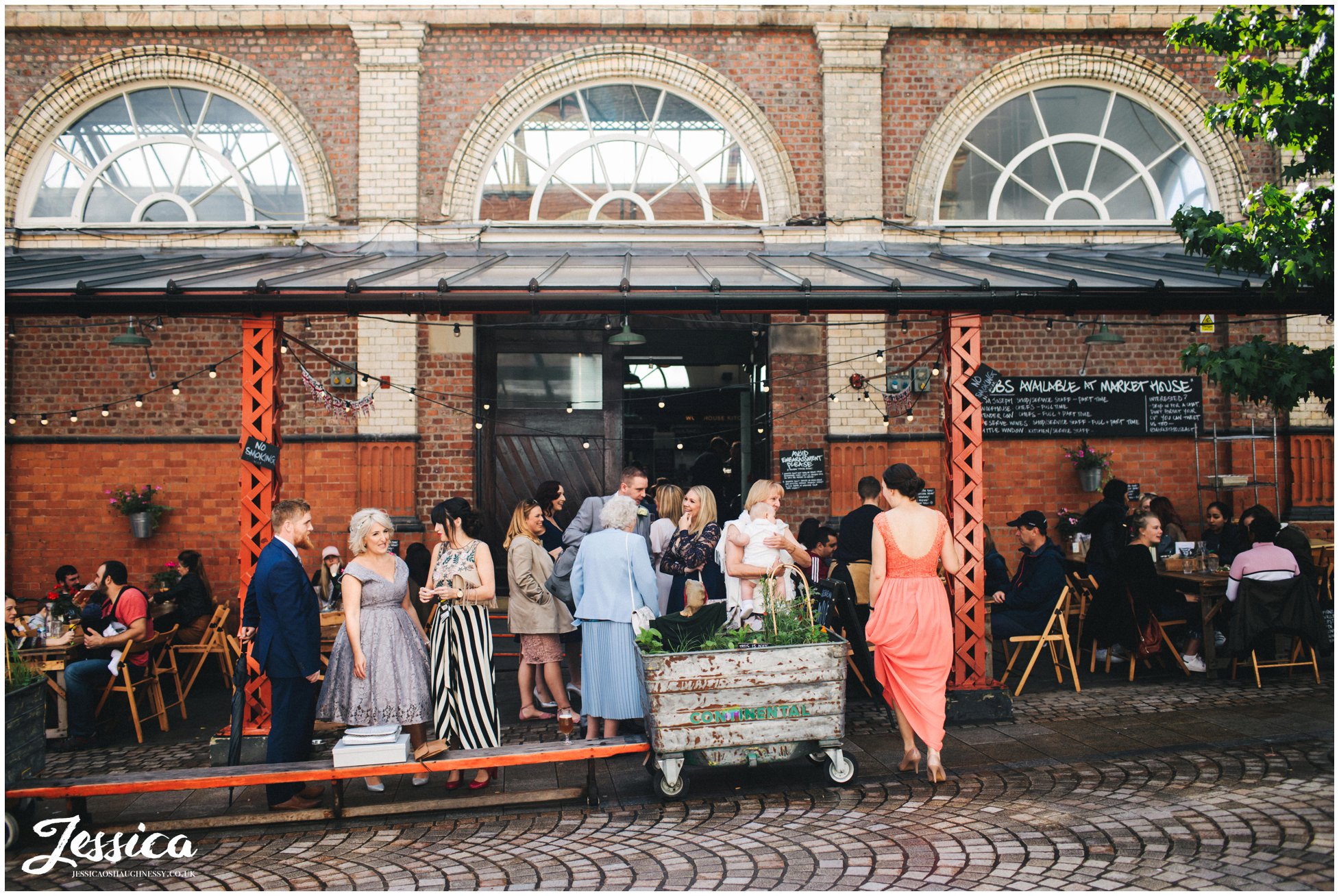 photograph of wedding guests outside altrincham market
