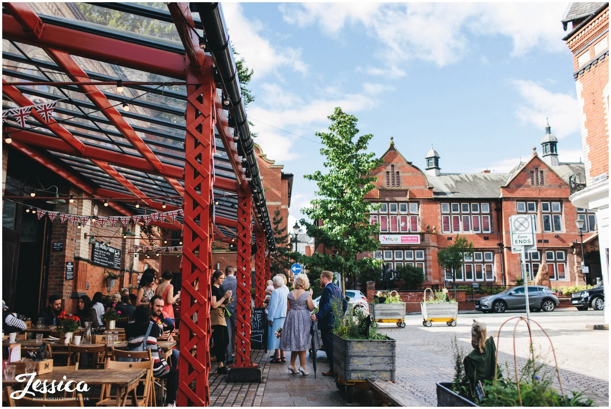 friends & family gather outside the market in altrincham