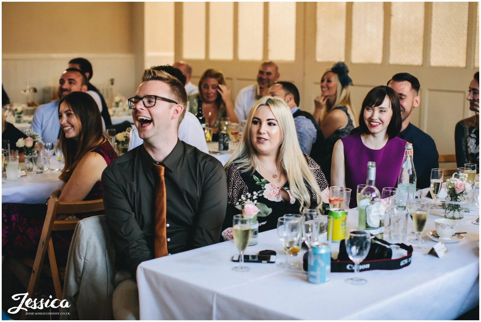 wedding guests enjoy the speeches at a manchester wedding