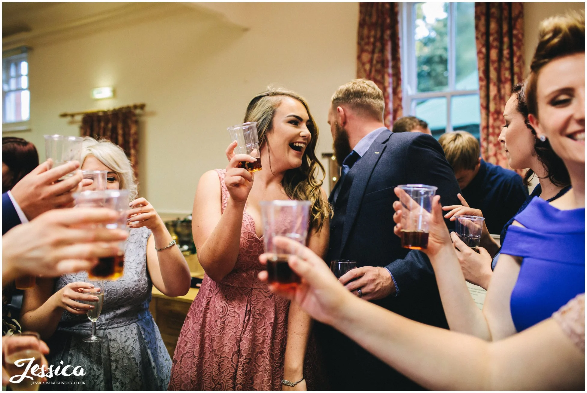 guests cheers before drinking shots