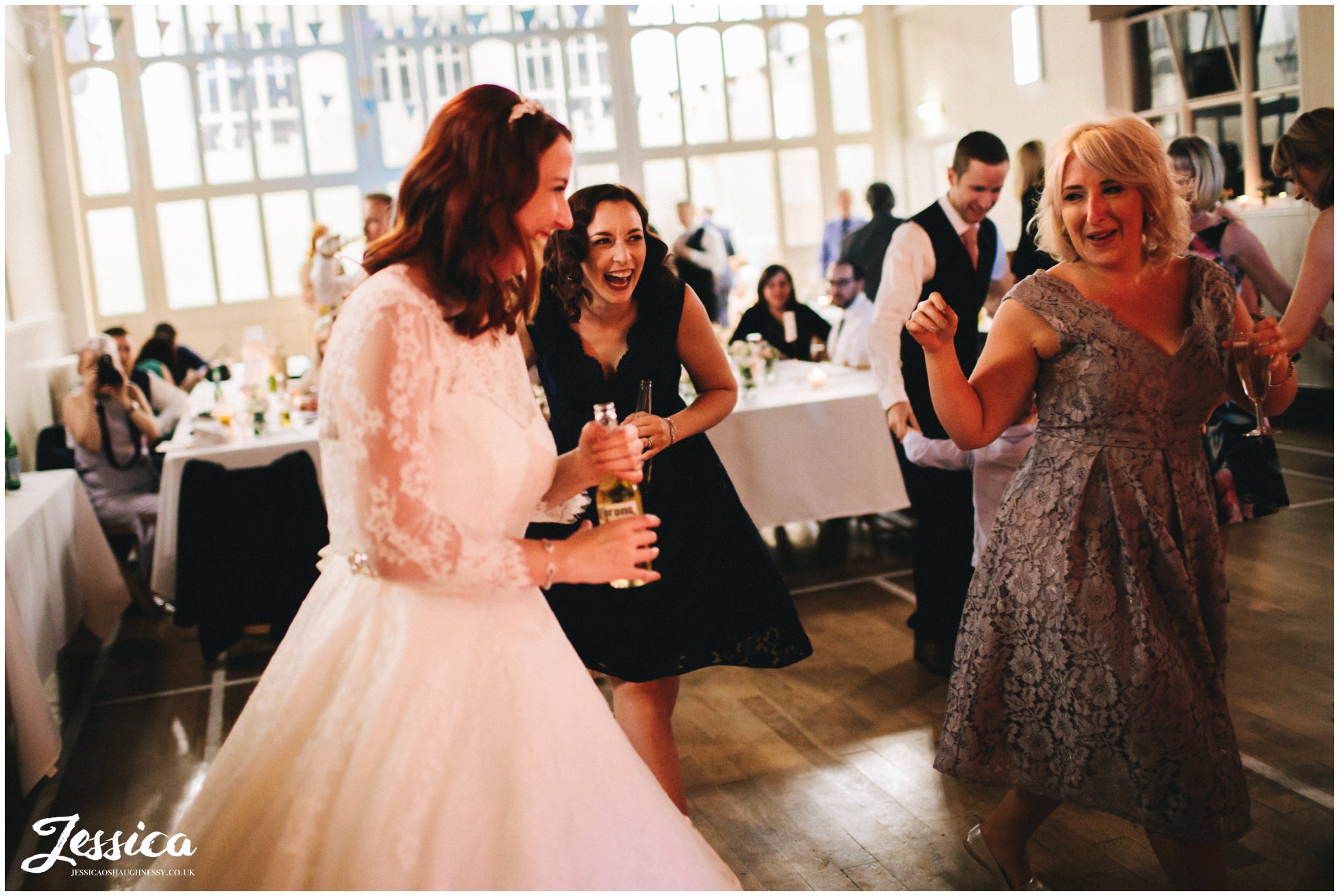 bride dances with her bridesmaids at her manchester wedding