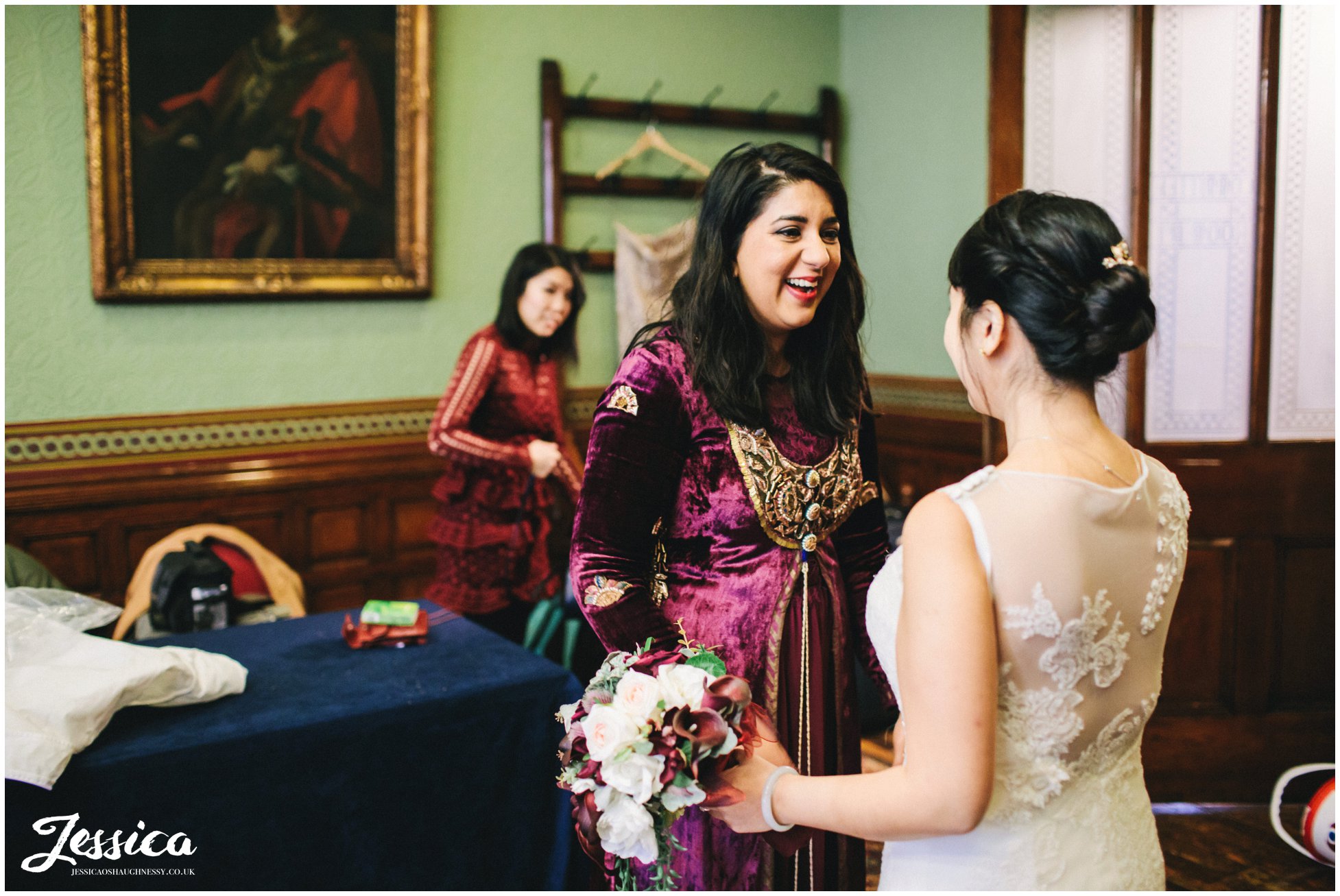 bridesmaid greets bride before the wedding in manchester