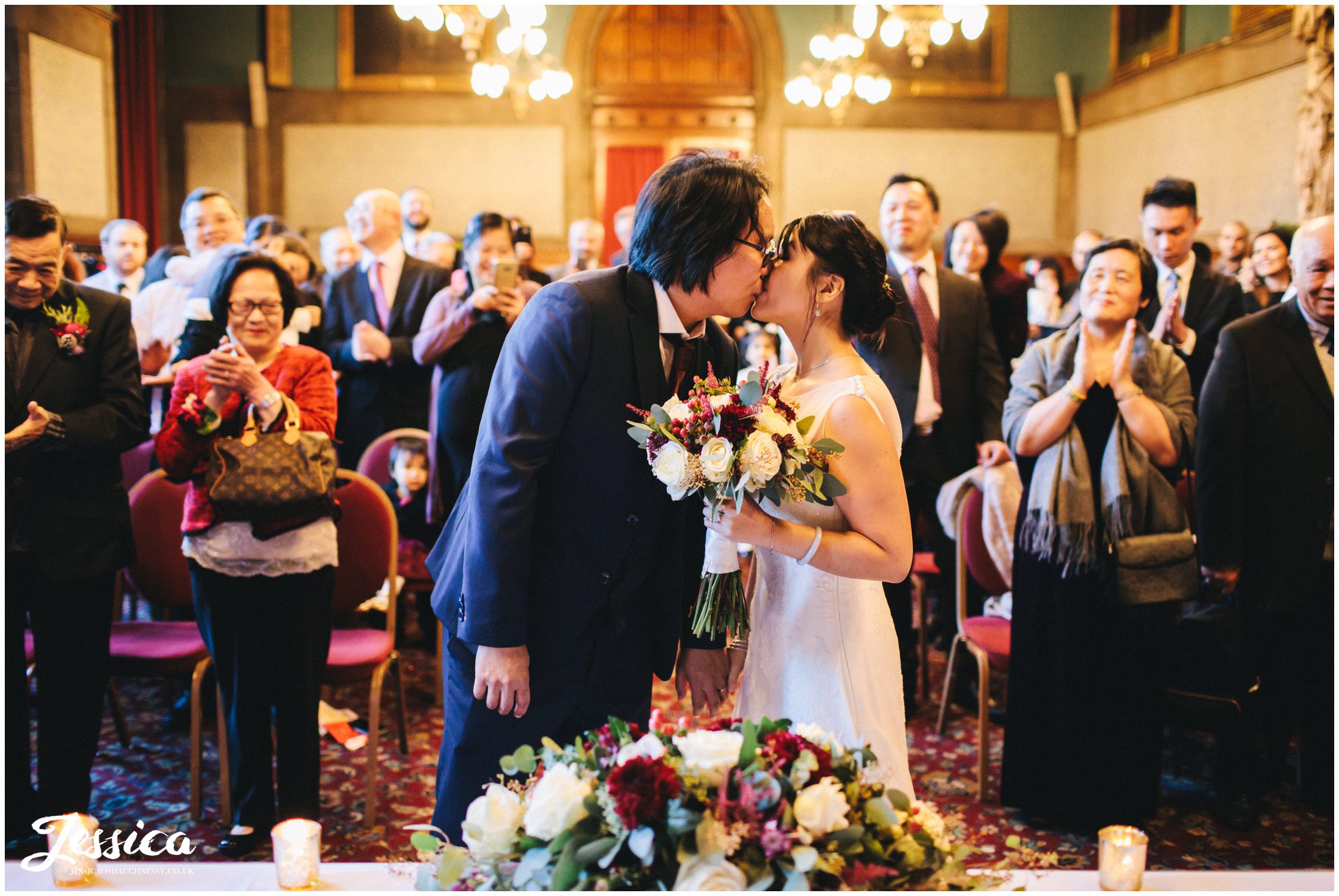 newly wed's share their first kiss