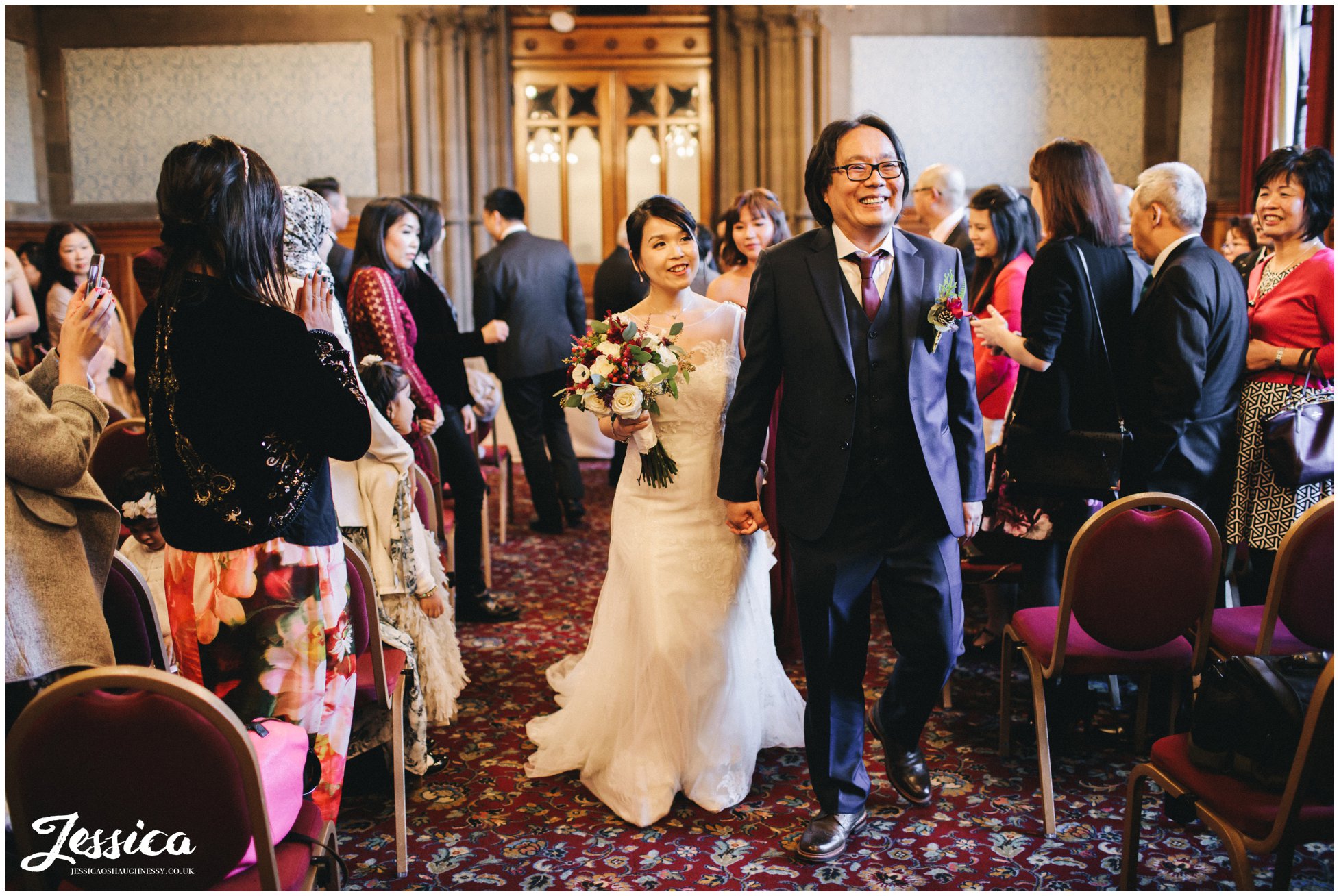 couple walk down the aisle at manchester town hall as husband and wife