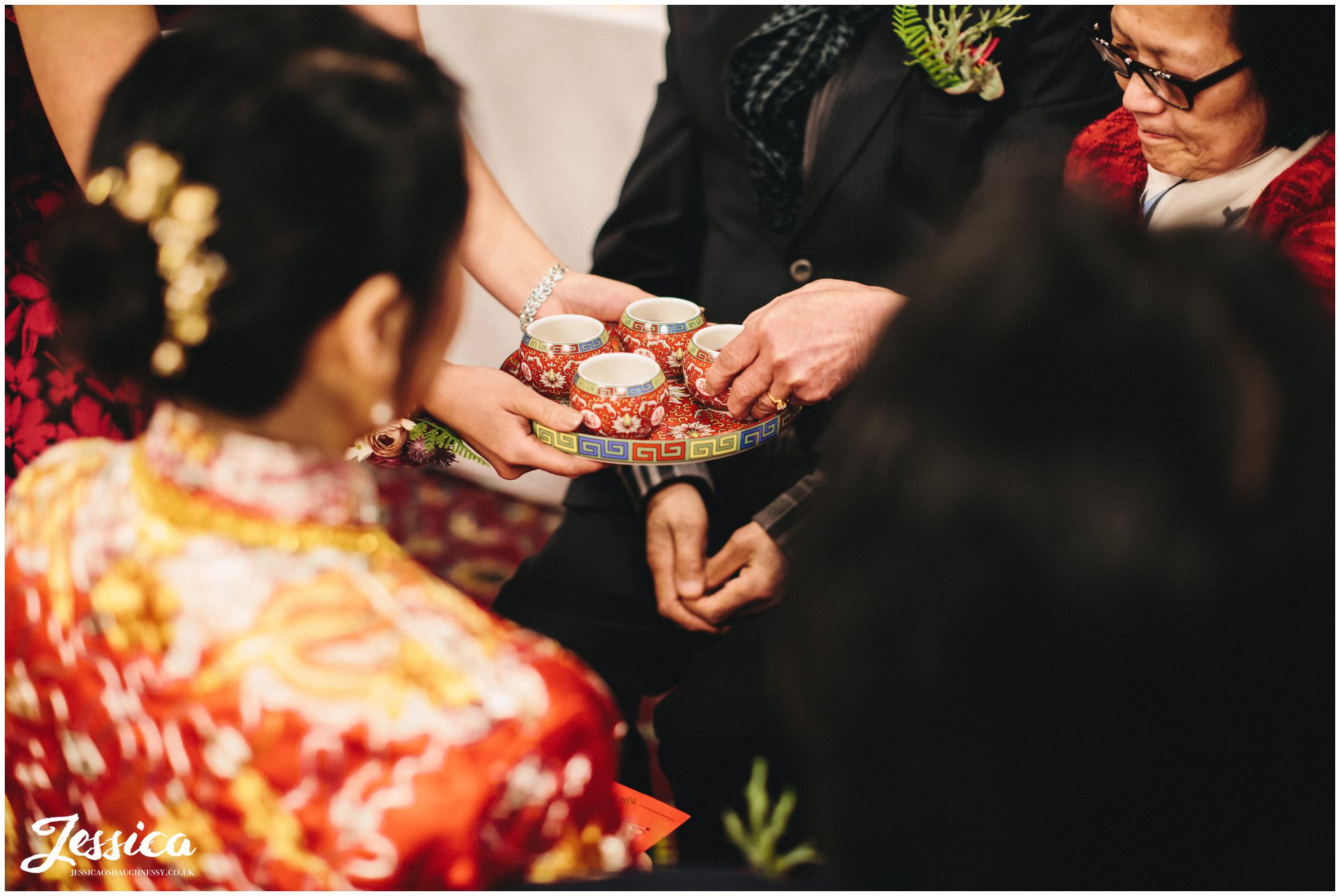 guests take tea during the traditional chinese ceremony
