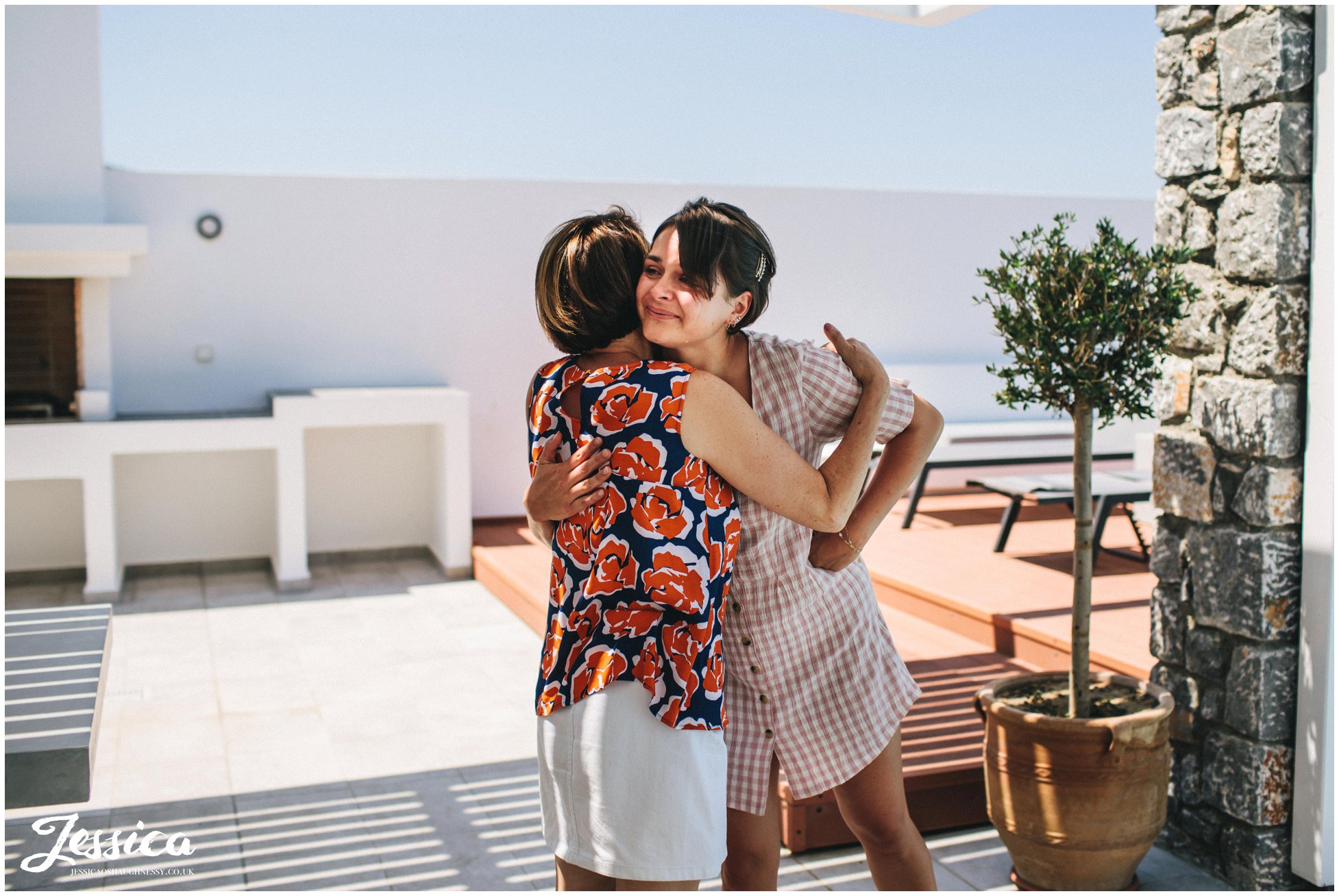 the brides sister cries as she sees her in her dress