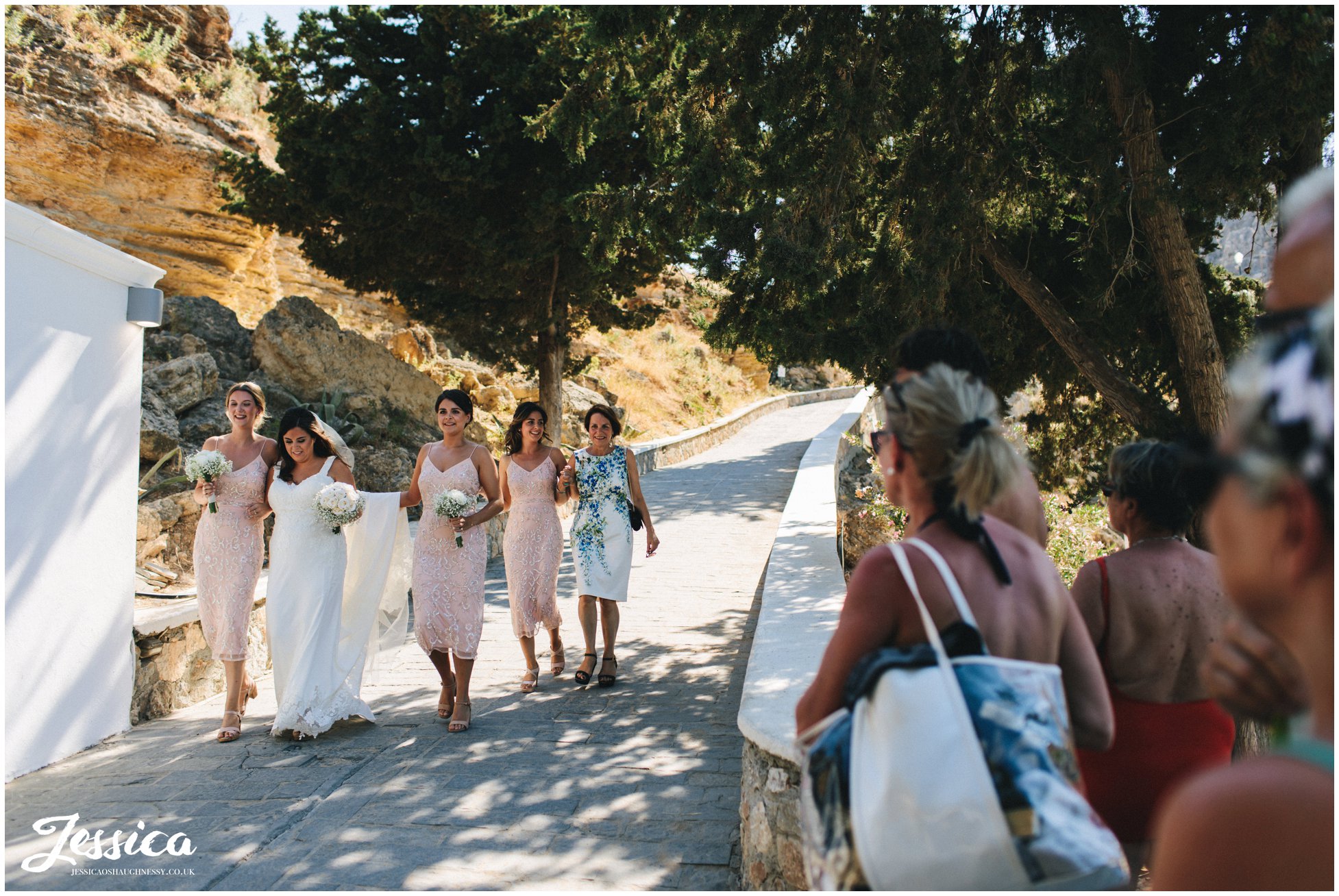 the public watch the bride walk down to make her entrance