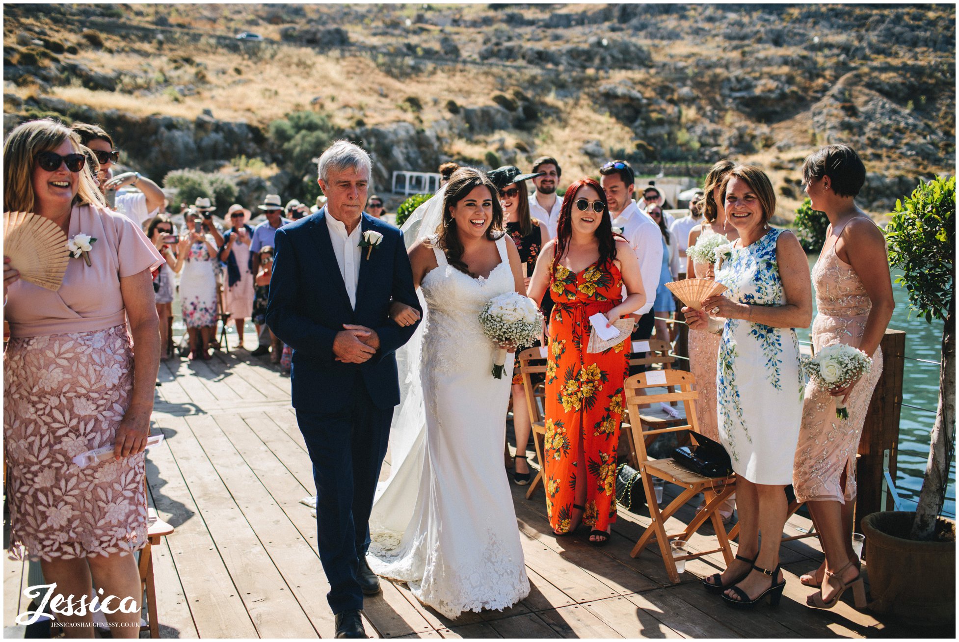 the bride walks down the aisle and see's her groom for the first time